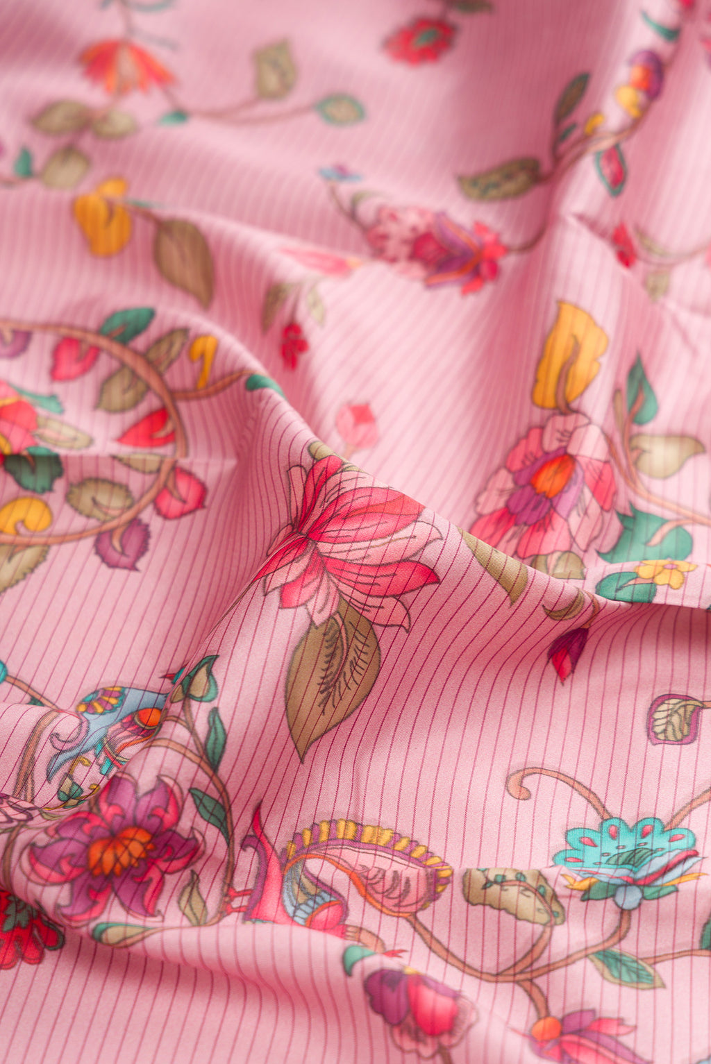Close up of Pink Kanchipuram Silk Saree with Printed design on the body and Plain Border.  displaying folds