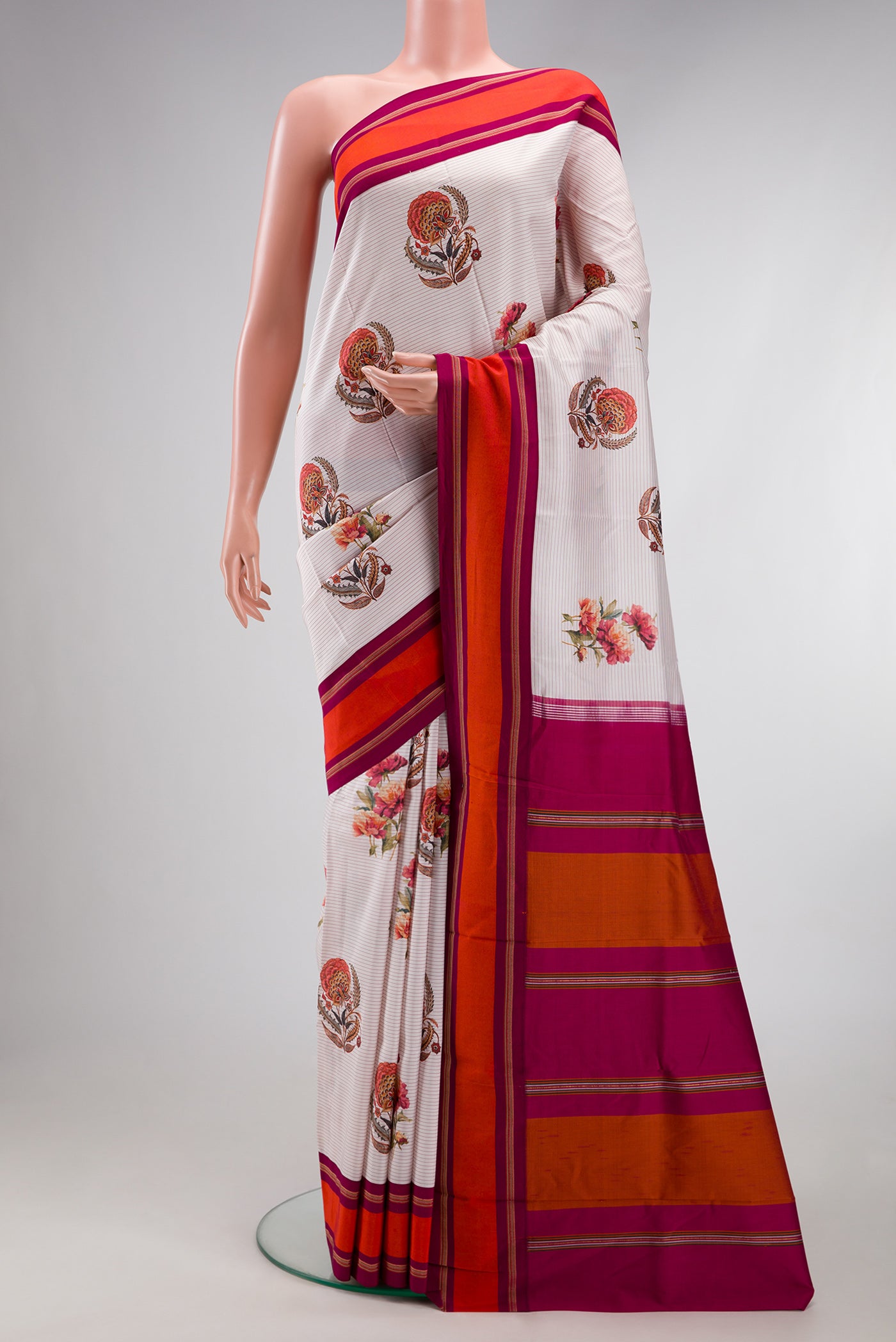 Off White Kanchipuram Silk Saree with Printed design on the body and Plain Border.  displayed on a mannequin