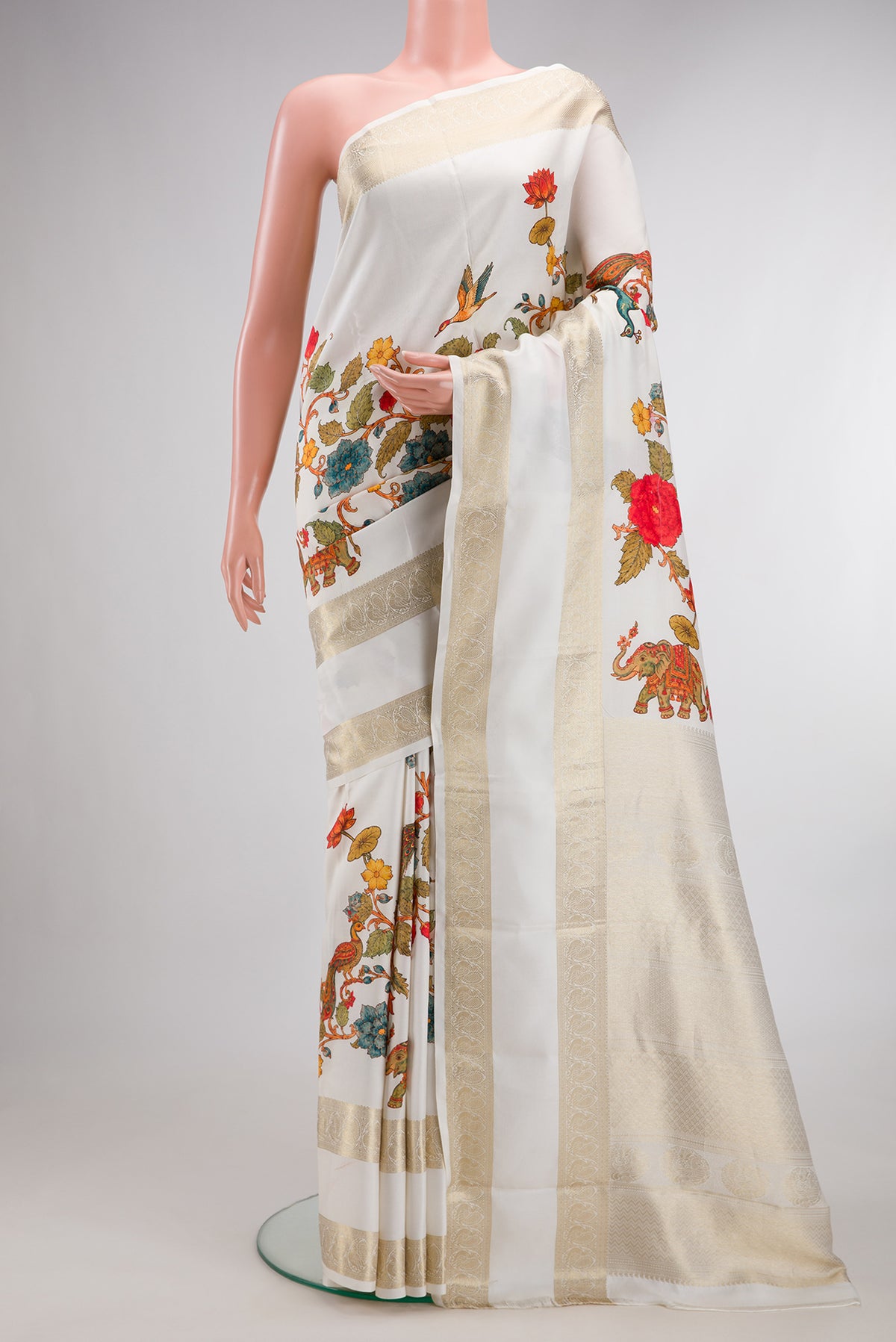Pure Silk Off White Kanchipuram Saree with Printed design on the body and Fancy Border.  displayed on a mannequin