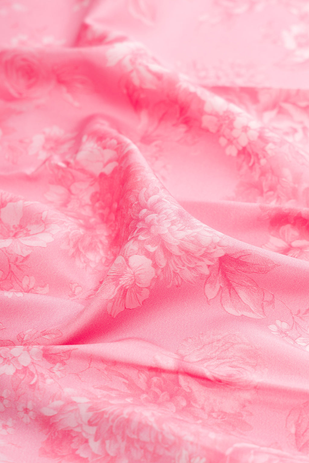 Close up of Pink Kanchipuram Silk Saree with Printed design on the body and Plain Border.  displaying folds