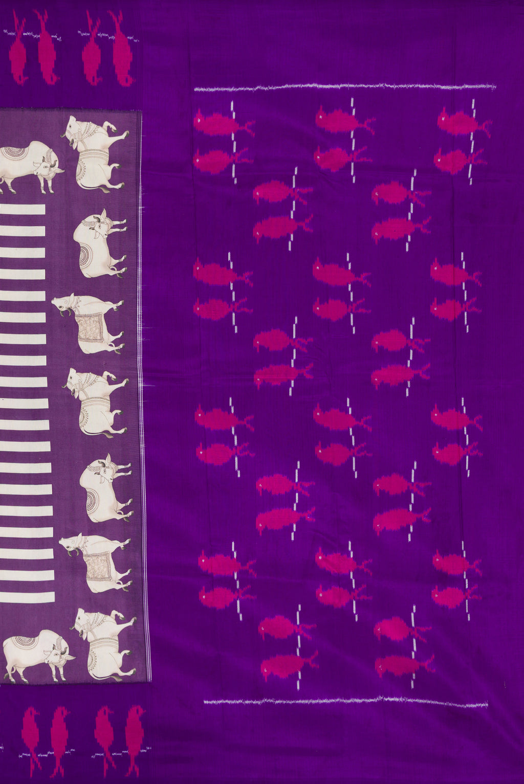 Close up image of the pallu of Purple Kanchipuram Silk Saree with Printed design on the body and Ikat Border. 