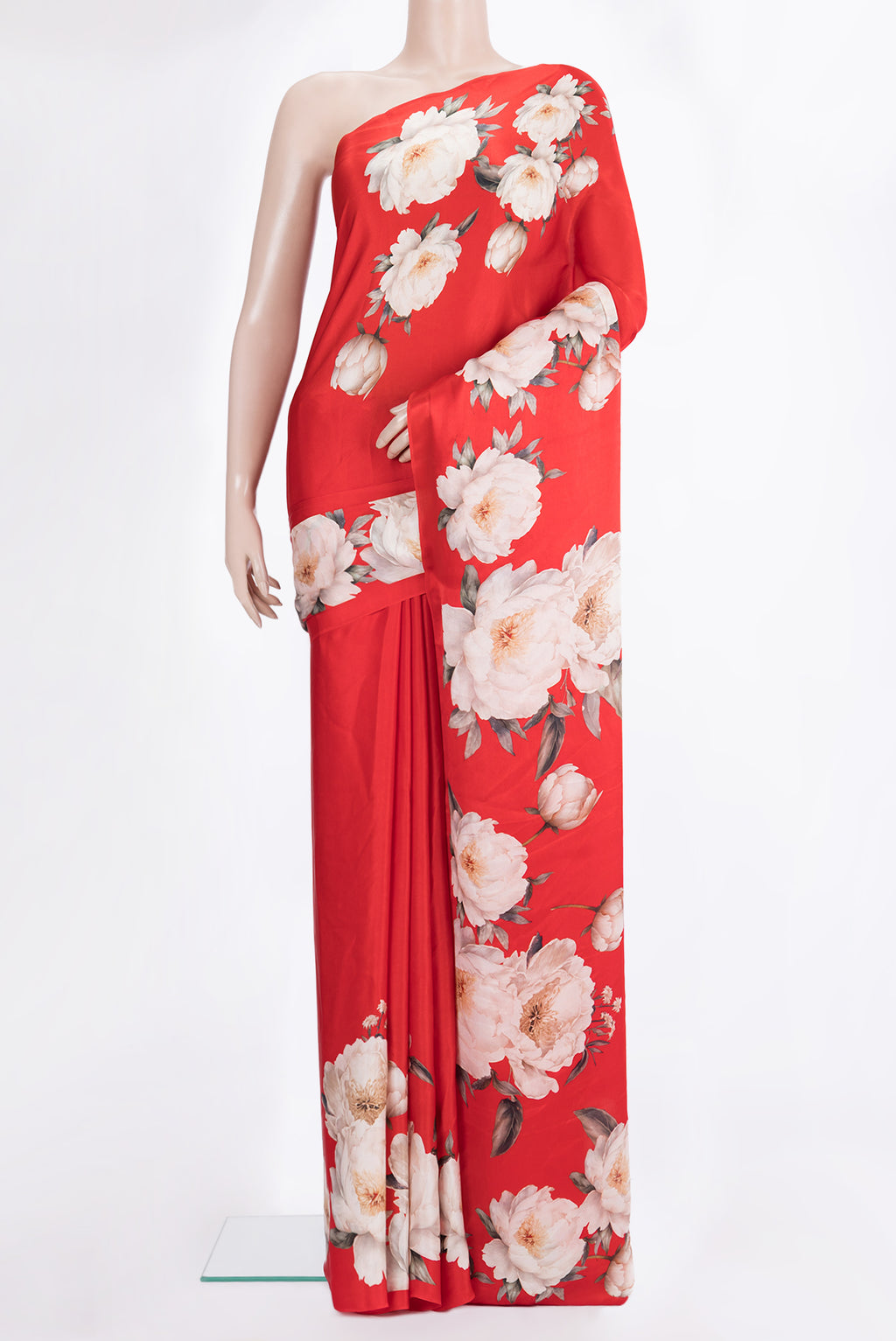 Red Crepe Saree with Floral Print on the body and Without Border.  displayed on a mannequin