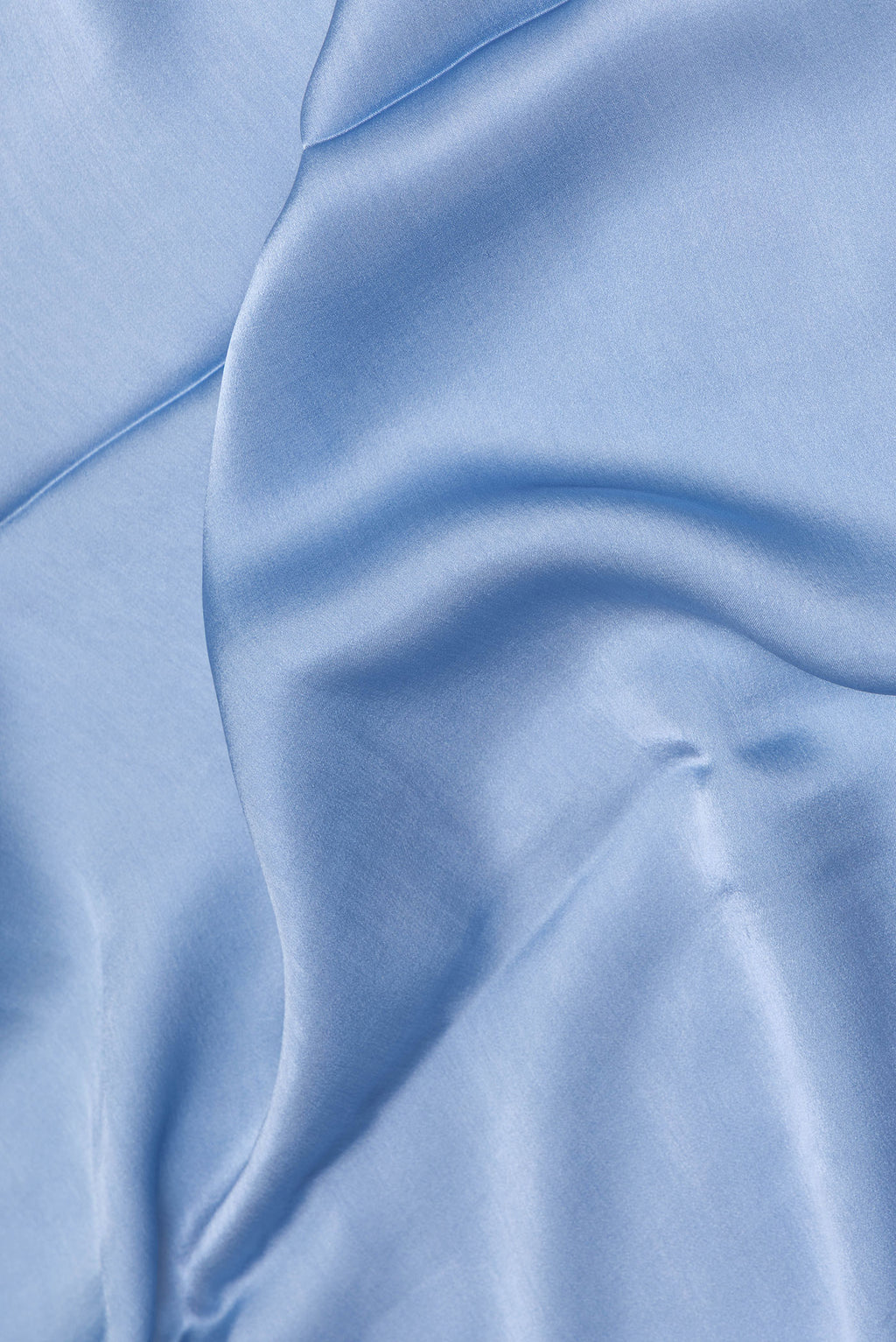 Close up of Maya Blue Crepe Saree with Plain Body and Without Border.  displaying folds