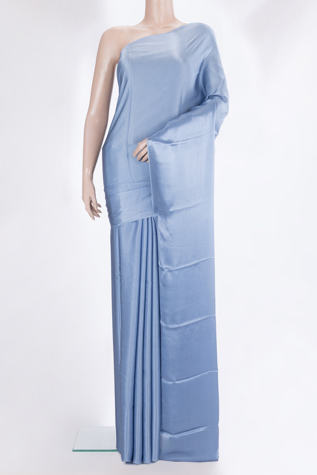 Maya Blue Crepe Saree with Plain Body and Without Border.  displayed on a mannequin
