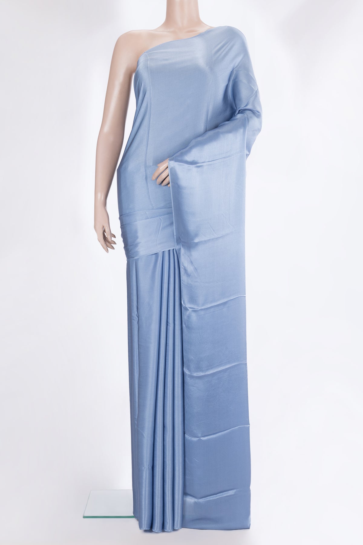 Maya Blue Crepe Saree with Plain Body and Without Border.  displayed on a mannequin