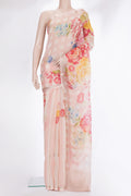 Peach Organza Saree with Floral Print on the body and Zari Border.  displayed on a mannequin
