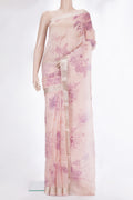 Rose Gold Organza Saree with Floral Print on the body and Zari Border.  displayed on a mannequin
