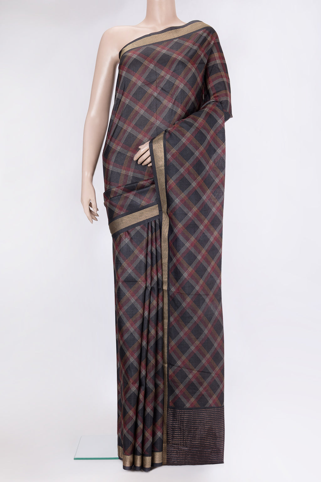 Black Tussar Silk Saree with Checked design on the body and Zari Border.  displayed on a mannequin