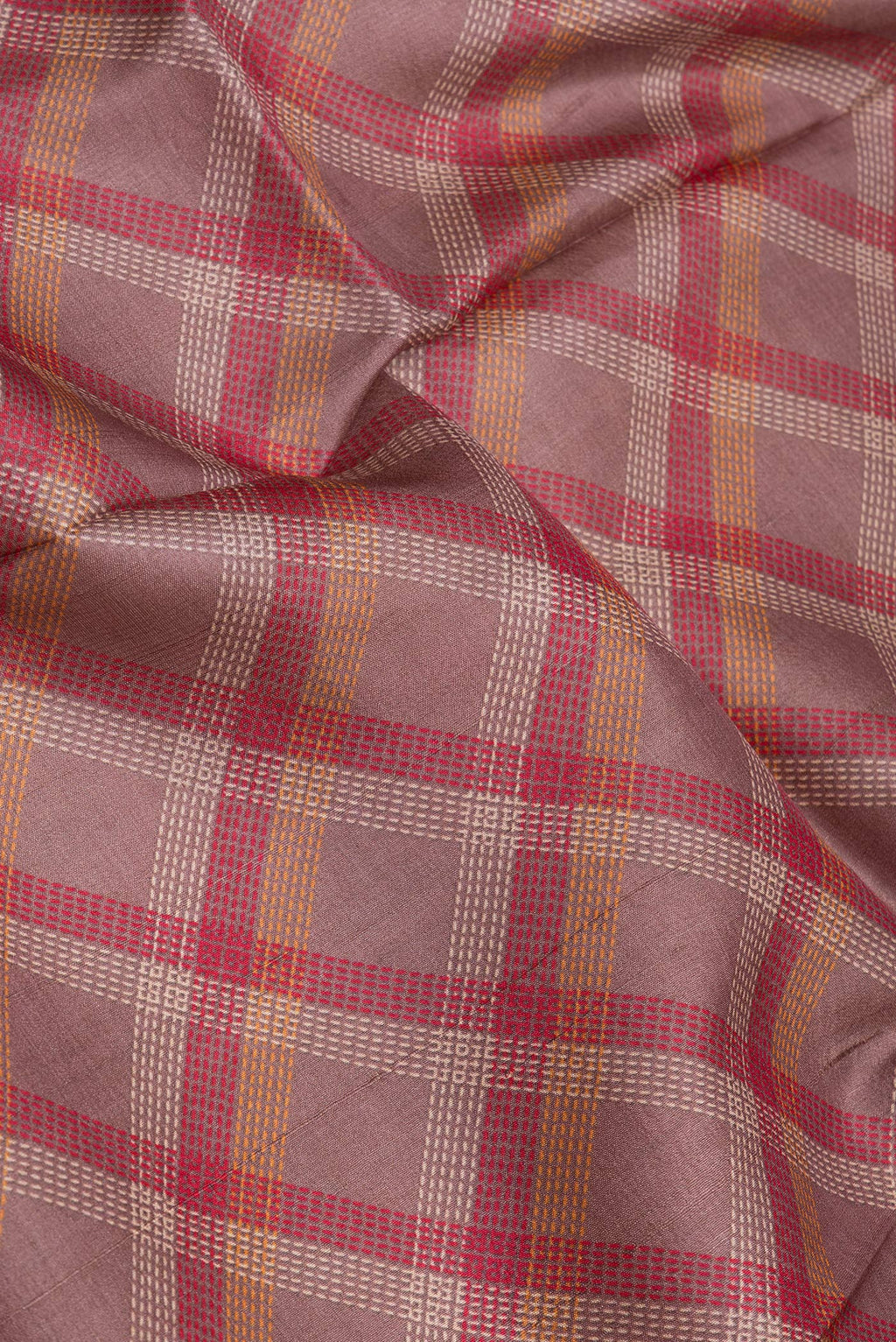 Close up of Mauve Tussar Silk Saree with Checked design on the body and Zari Border.  displaying folds