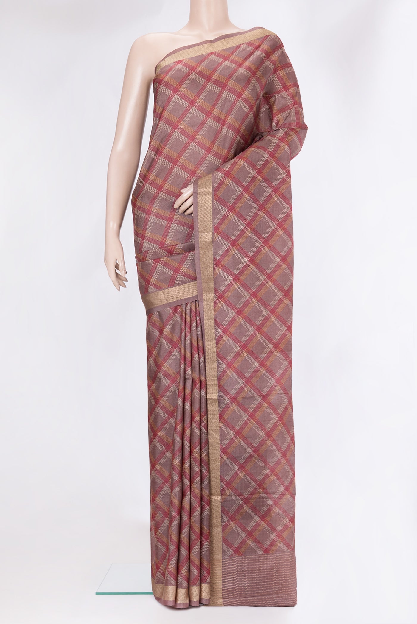 Mauve Tussar Silk Saree with Checked design on the body and Zari Border.  displayed on a mannequin