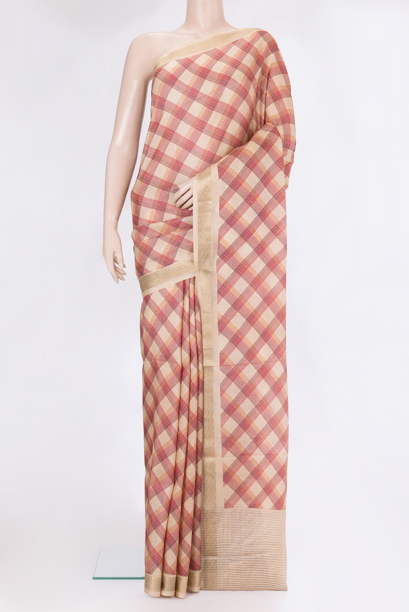Beige Tussar Silk Saree with Checked design on the body and Zari Border.  displayed on a mannequin