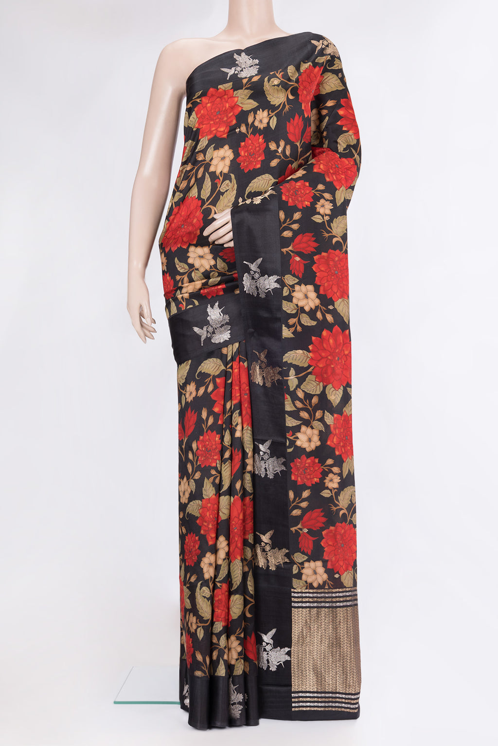 Black Tussar Silk Saree with Floral Print on the body and Fancy Border.  displayed on a mannequin