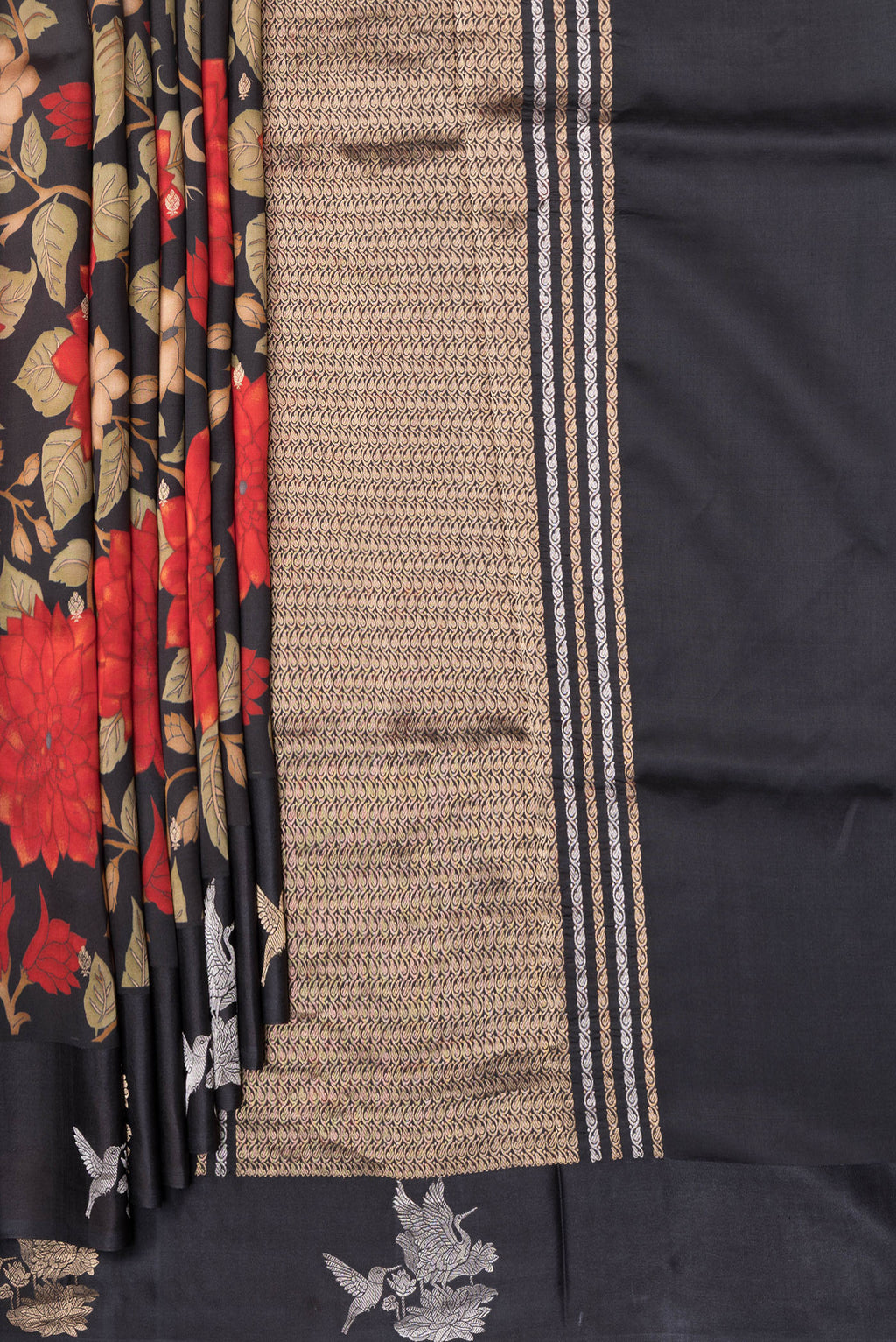 Pleats and pallu of Black Tussar Silk Saree with Floral Print on the body and Fancy Border. 