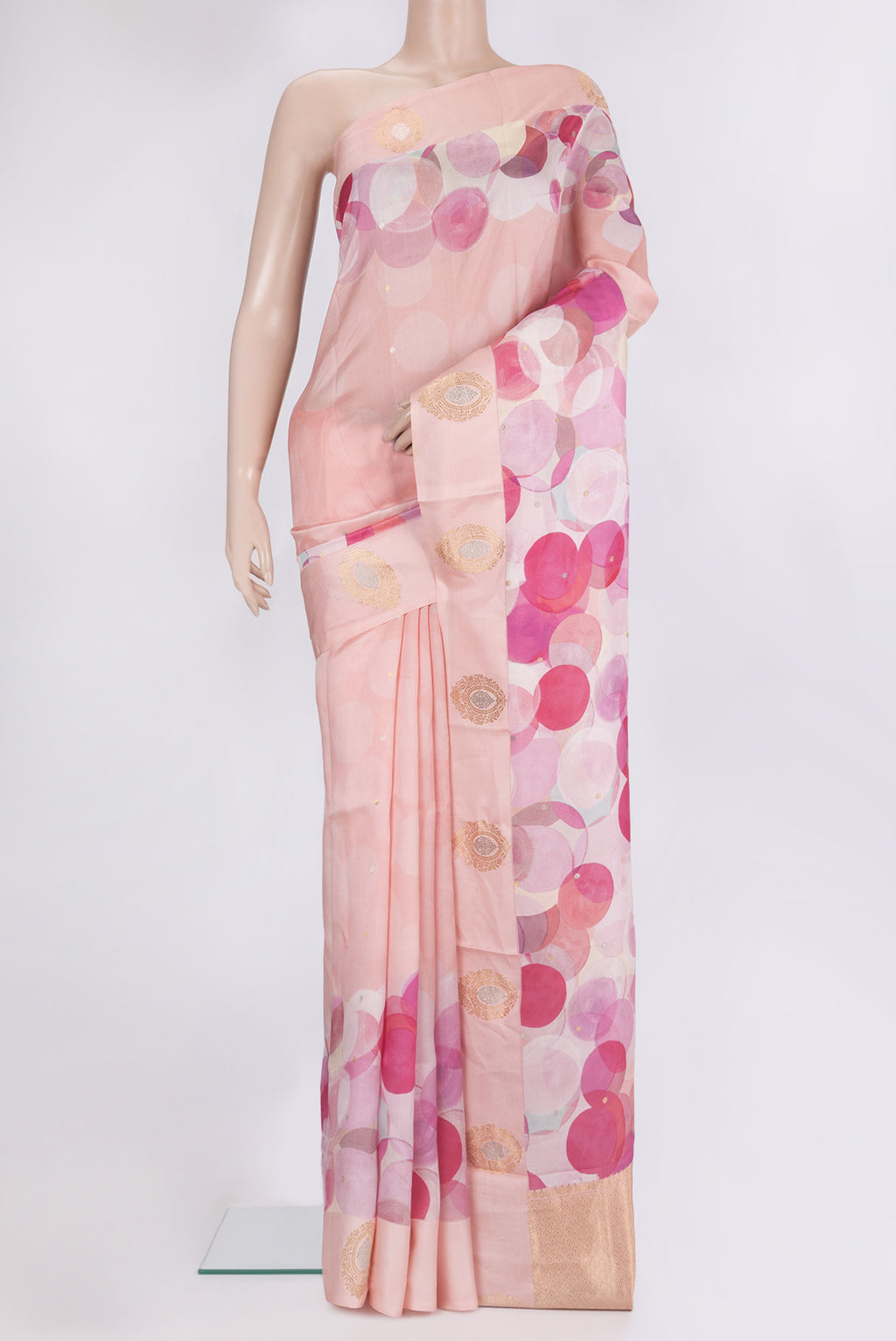 Pure Silk Peach Tussar Saree with Printed design on the body and Fancy Border.  displayed on a mannequin