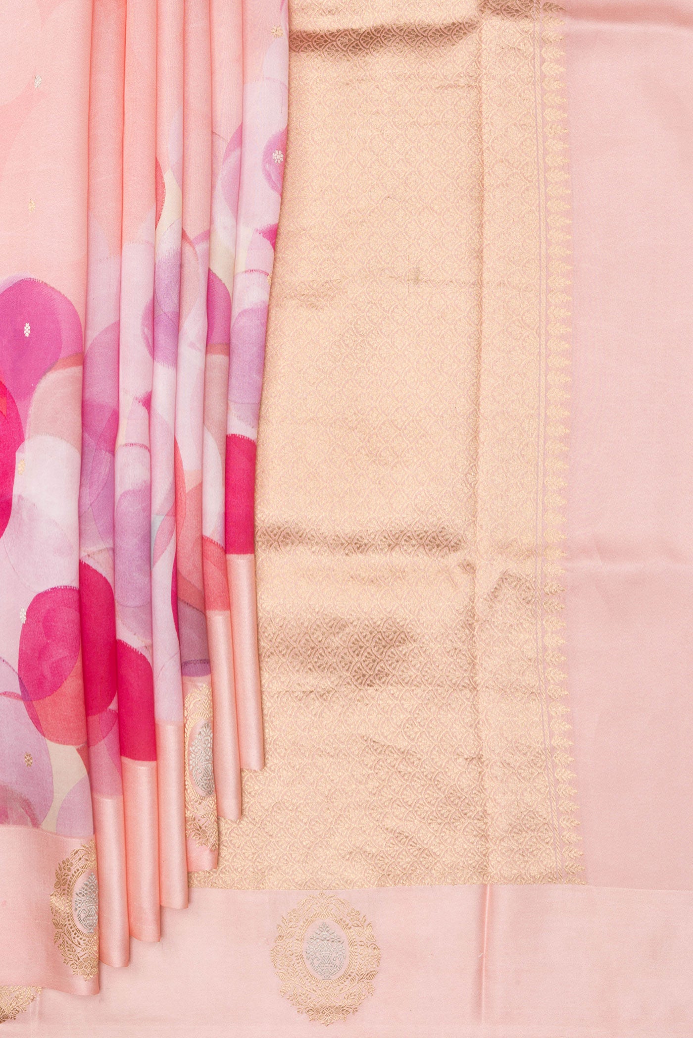 Pleats and pallu of Pure Silk Peach Tussar Saree with Printed design on the body and Fancy Border. 