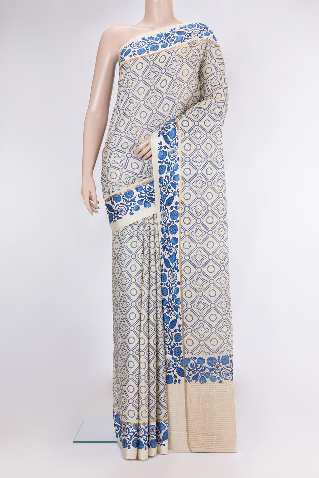 Beige Tussar Silk Saree with Bandhani Print on the body and Fancy Border.  displayed on a mannequin