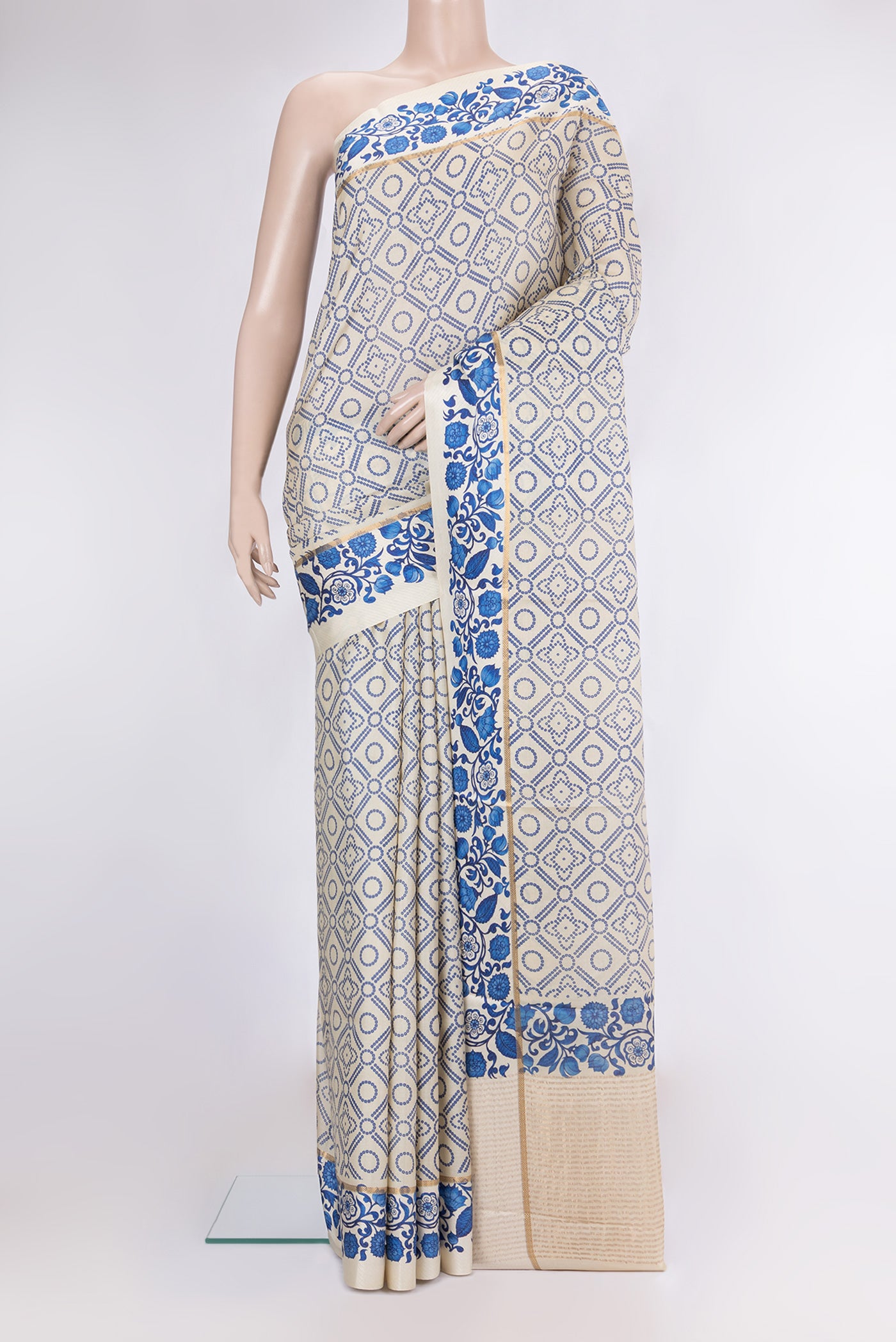 Beige Tussar Silk Saree with Bandhani Print on the body and Fancy Border.  displayed on a mannequin