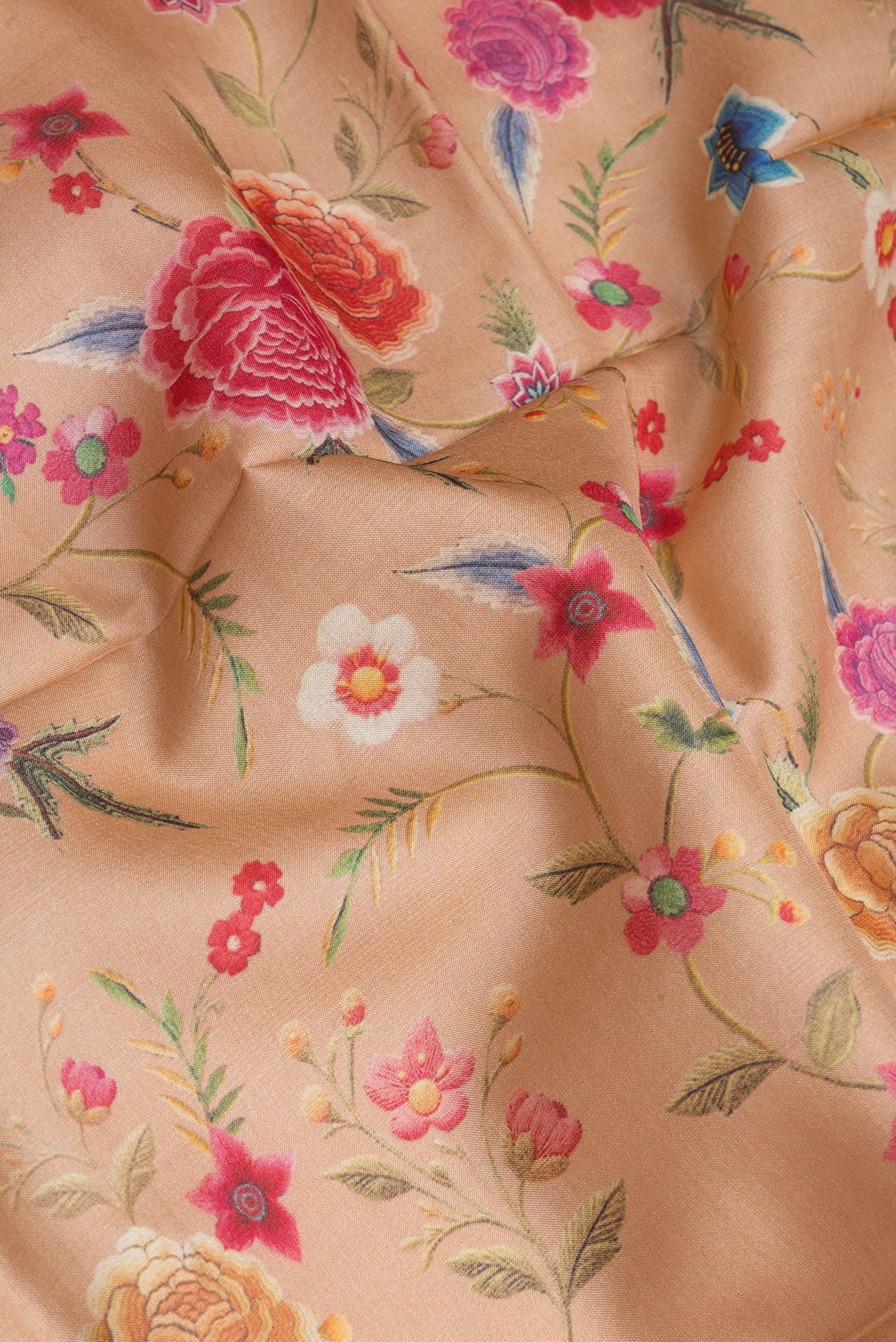 Close up of Dark Beige Tussar Silk Saree with Printed design on the body and Fancy Border.  displaying folds