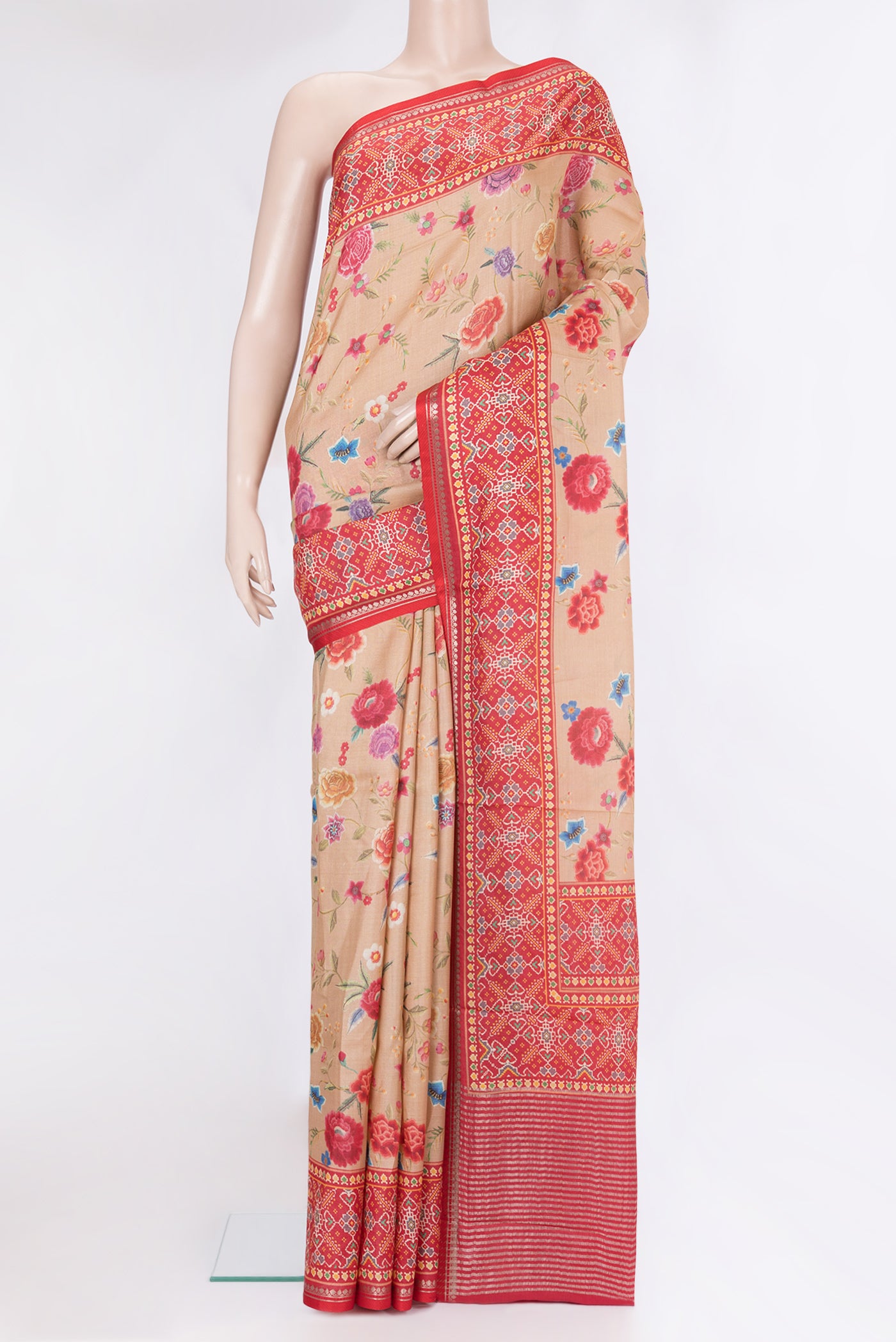 Dark Beige Tussar Silk Saree with Printed design on the body and Fancy Border.  displayed on a mannequin