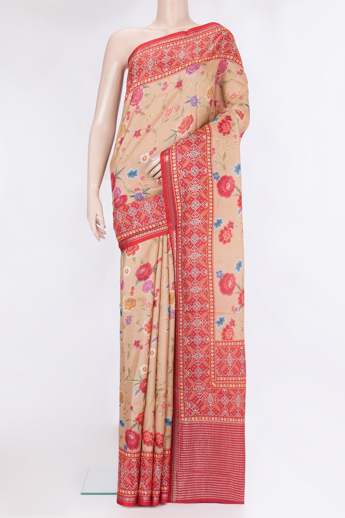 Dark Beige Tussar Silk Saree with Printed design on the body and Fancy Border.  displayed on a mannequin