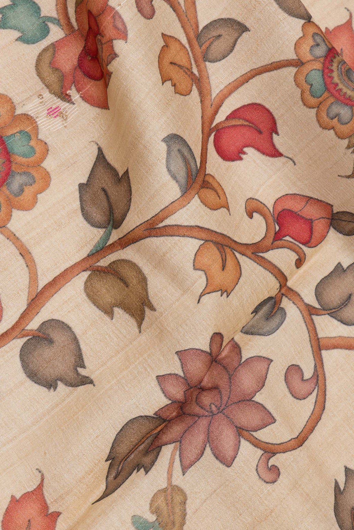 Close up of Beige Tussar Saree with Printed design on the body and Plain Border.  displaying folds