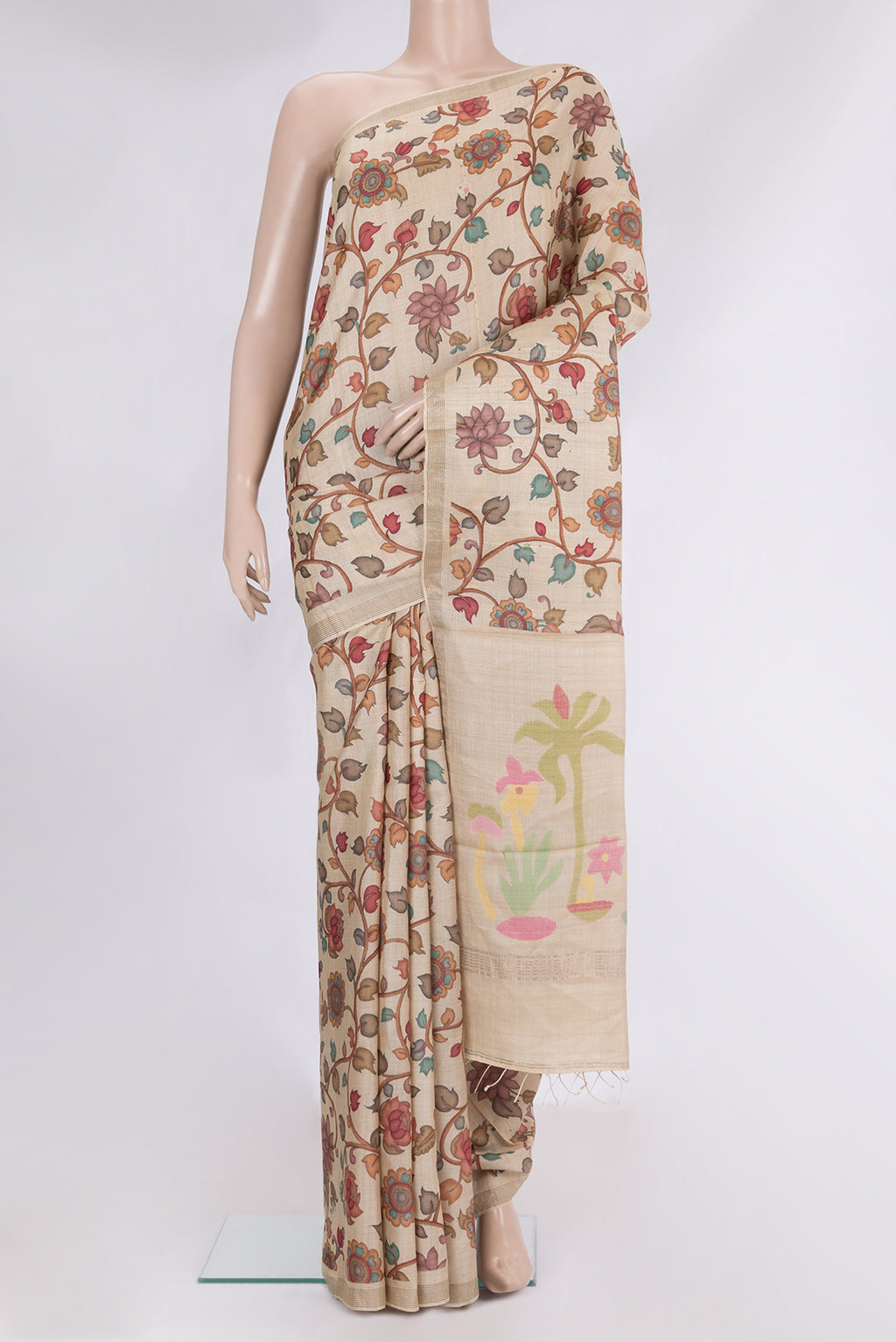 Beige Tussar Saree with Printed design on the body and Plain Border.  displayed on a mannequin