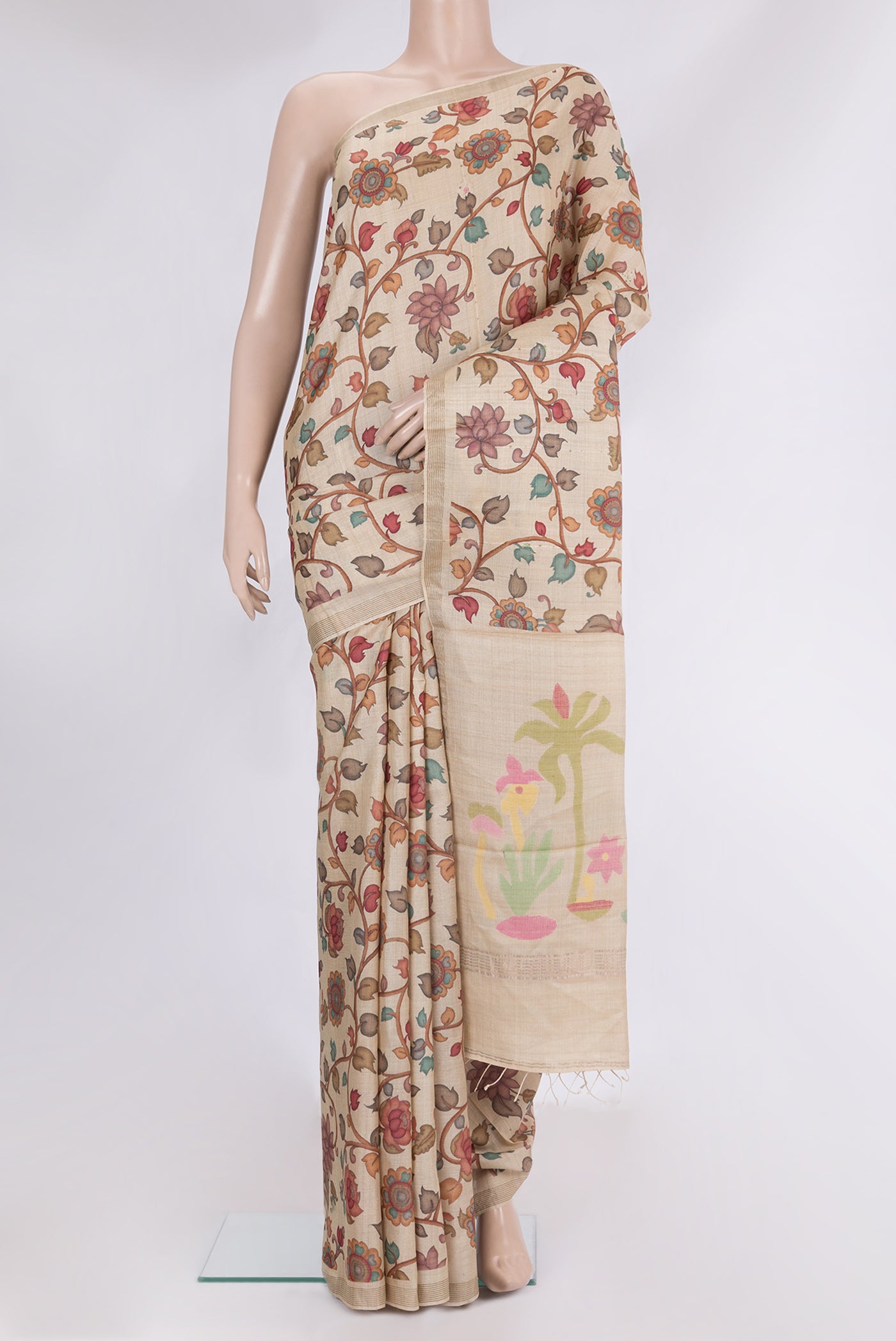 Beige Tussar Saree with Printed design on the body and Plain Border.  displayed on a mannequin