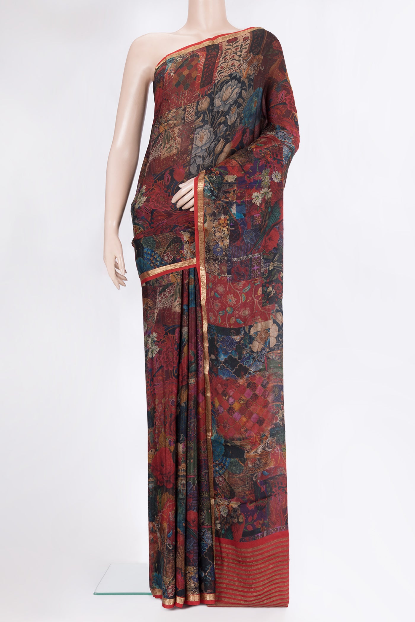 Maroon Crepe Saree with Printed design on the body and Zari Border.  displayed on a mannequin