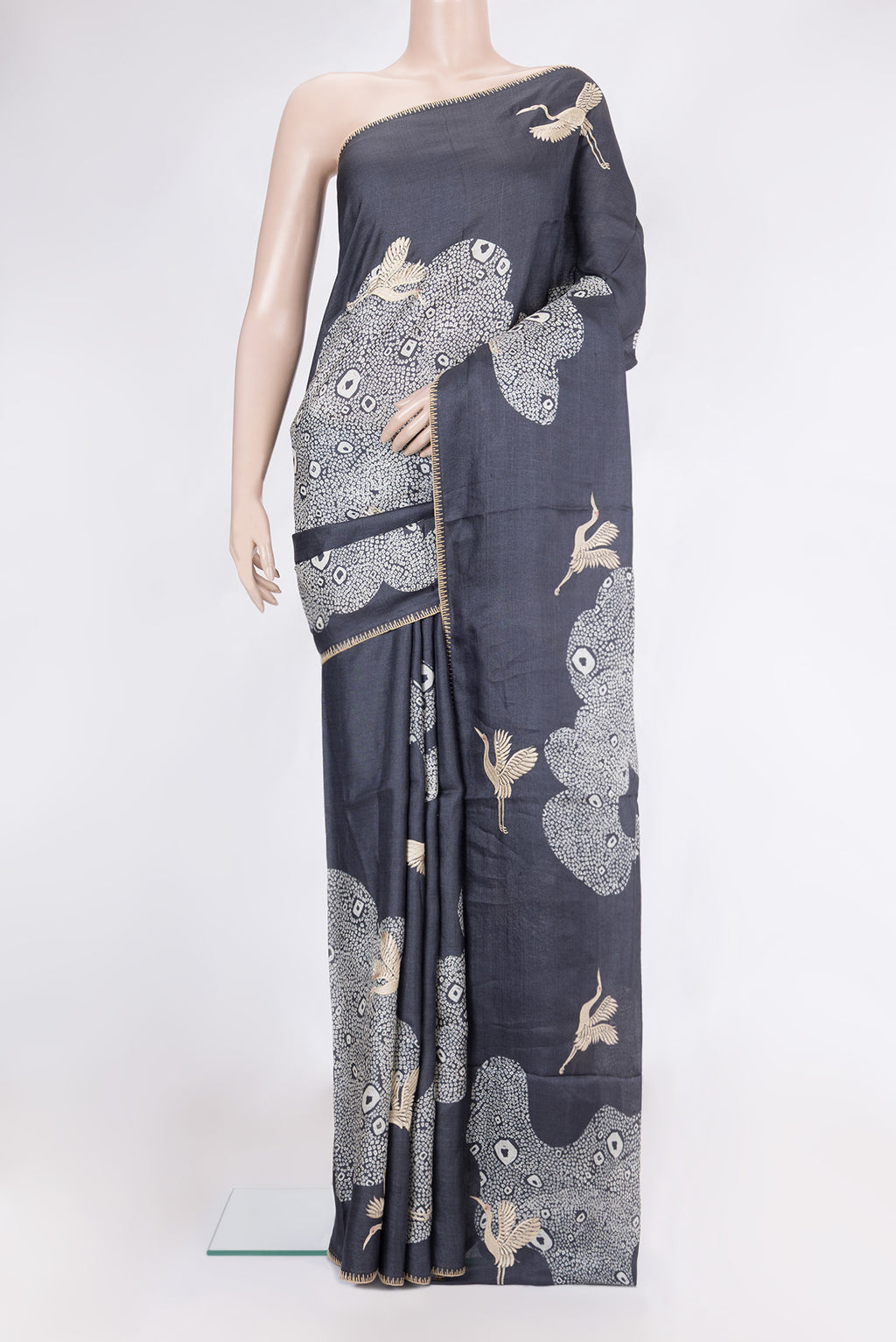 Navy Blue Tussar Silk Saree with Embroidery on the body and Embroidery Border.  displayed on a mannequin