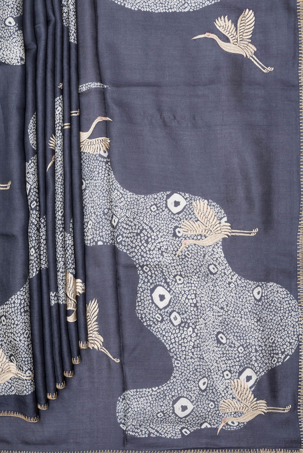 Pleats and pallu of Navy Blue Tussar Silk Saree with Embroidery on the body and Embroidery Border. 