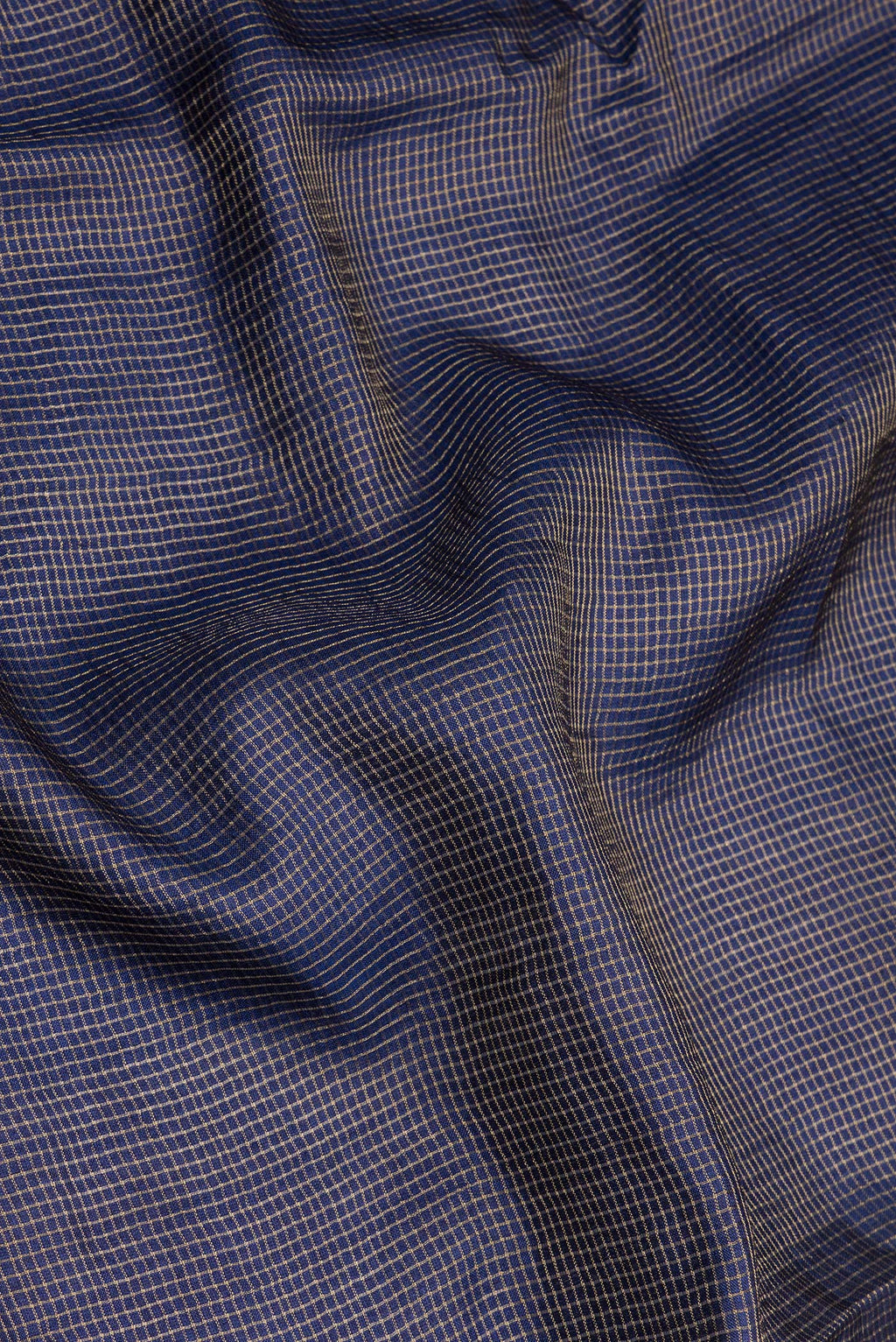 Close up of Navy Blue Tussar Silk Saree with Checked design on the body and Embroidery Border.  displaying folds