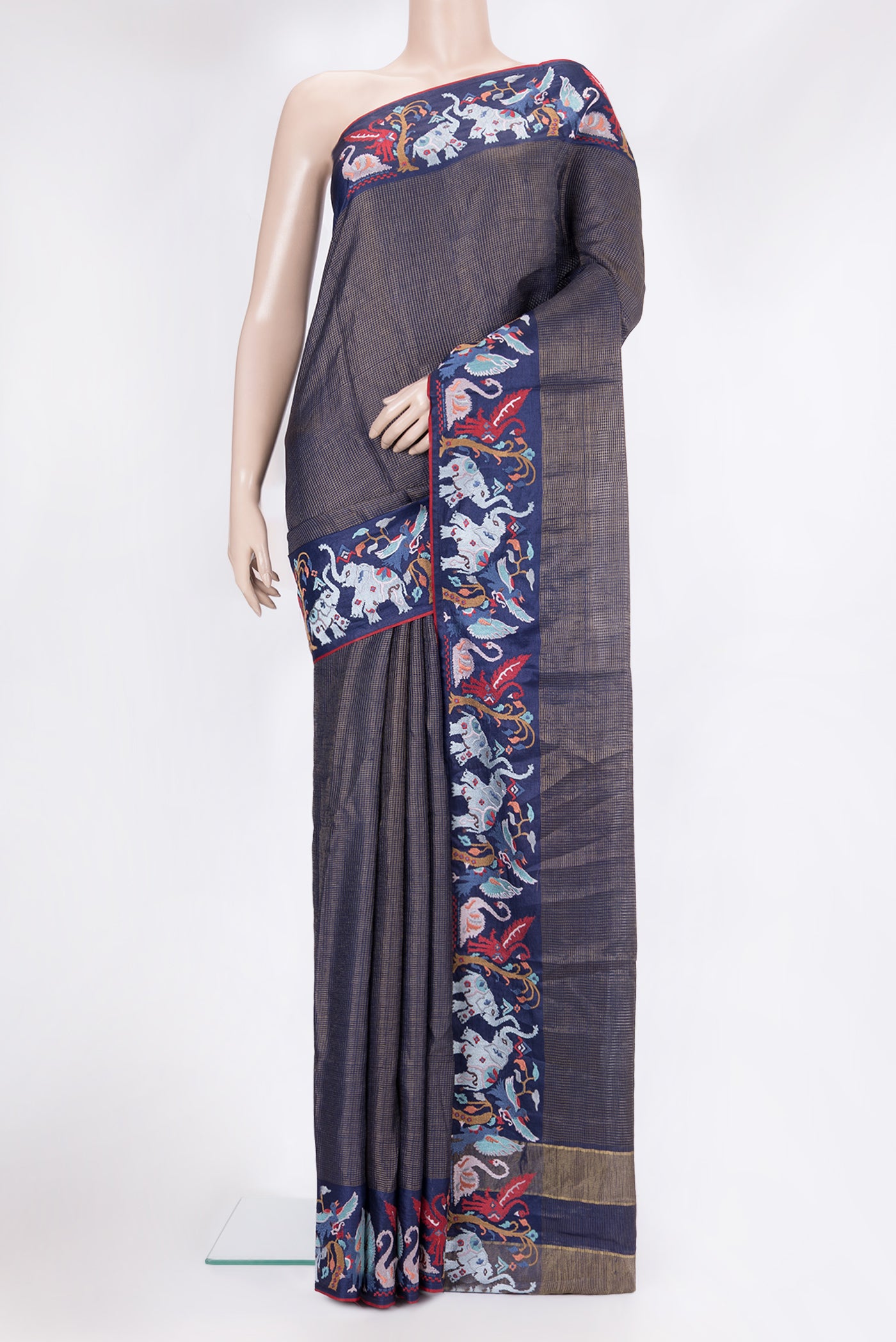 Navy Blue Tussar Silk Saree with Checked design on the body and Embroidery Border.  displayed on a mannequin