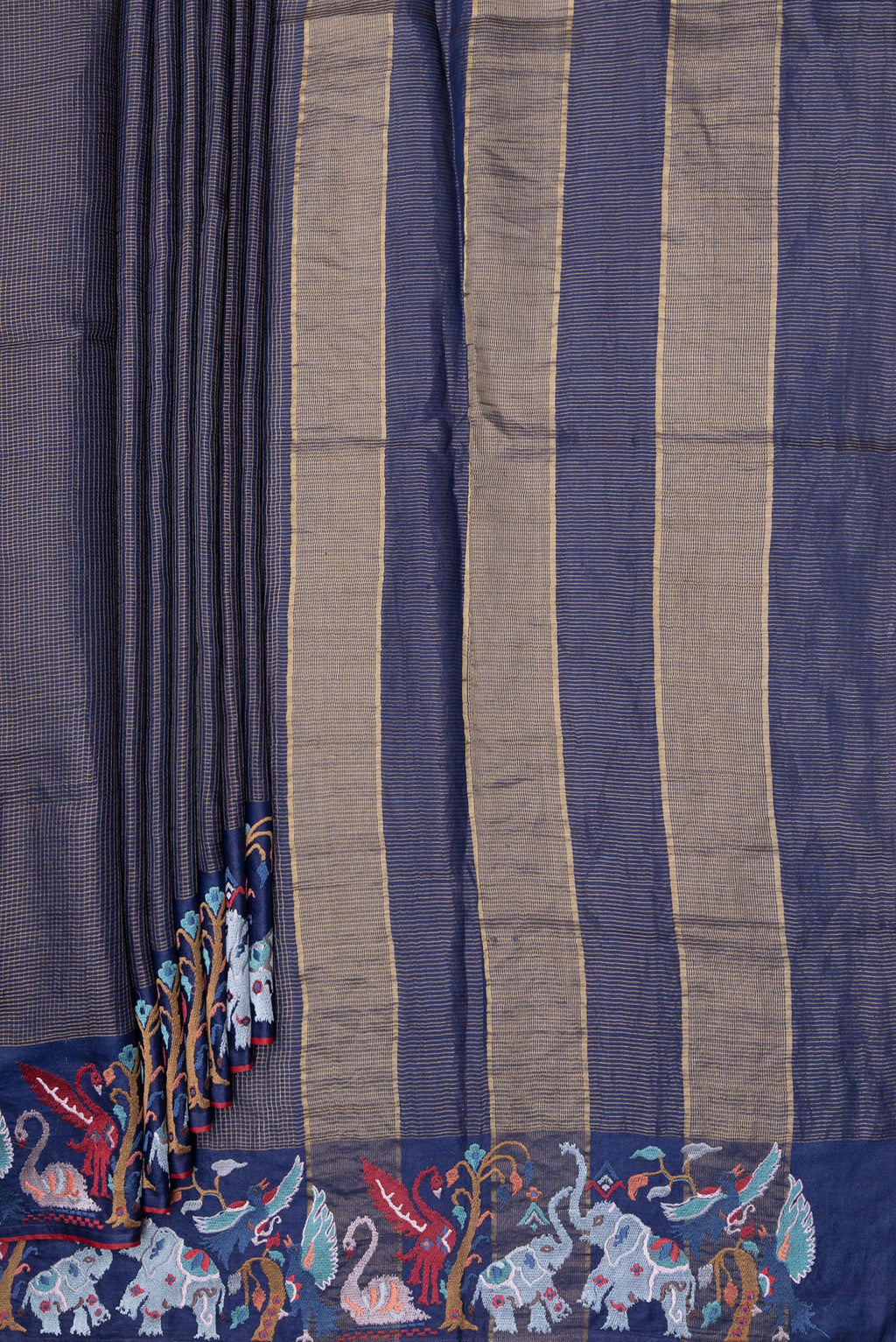 Pleats and pallu of Navy Blue Tussar Silk Saree with Checked design on the body and Embroidery Border. 