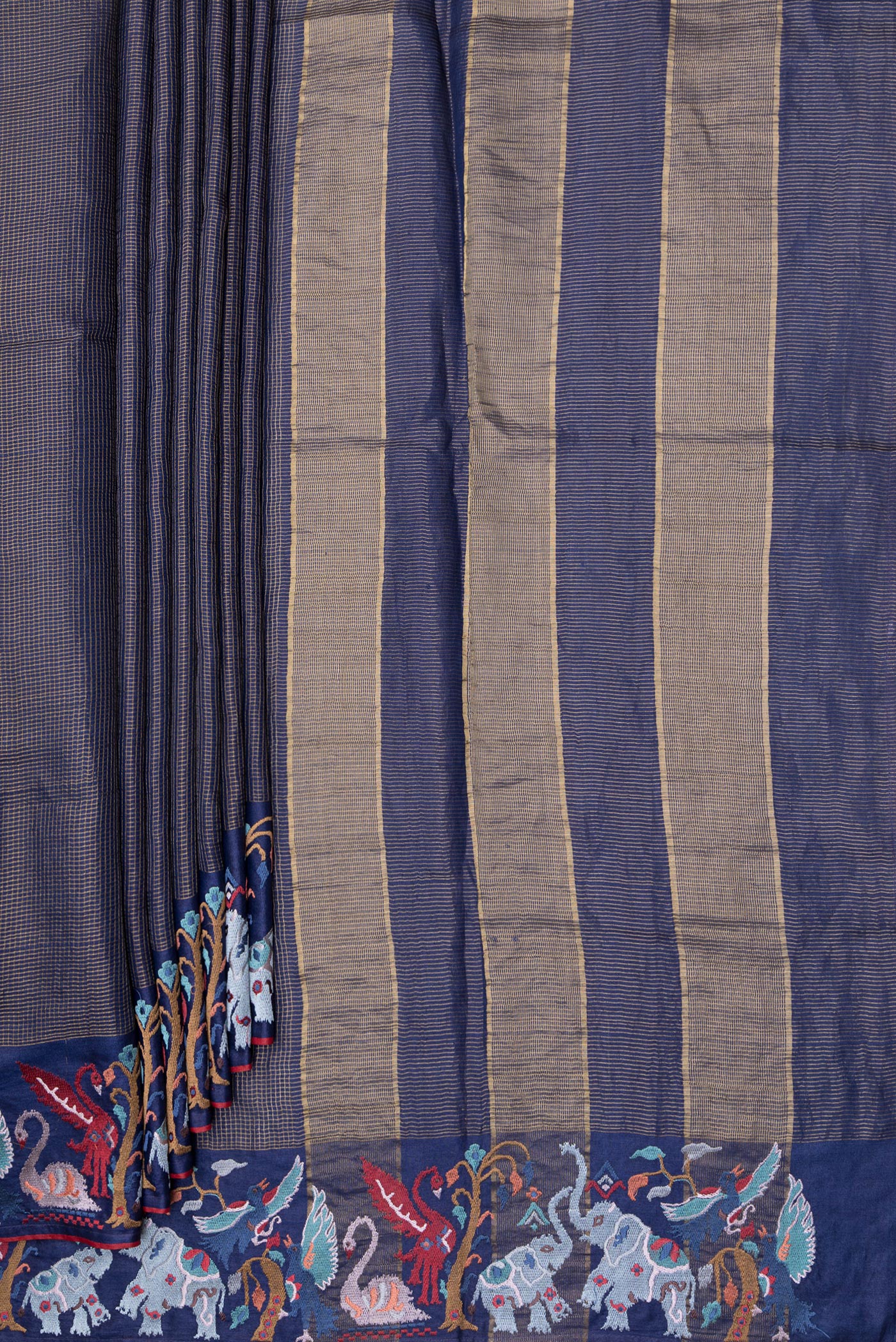 Pleats and pallu of Navy Blue Tussar Silk Saree with Checked design on the body and Embroidery Border. 