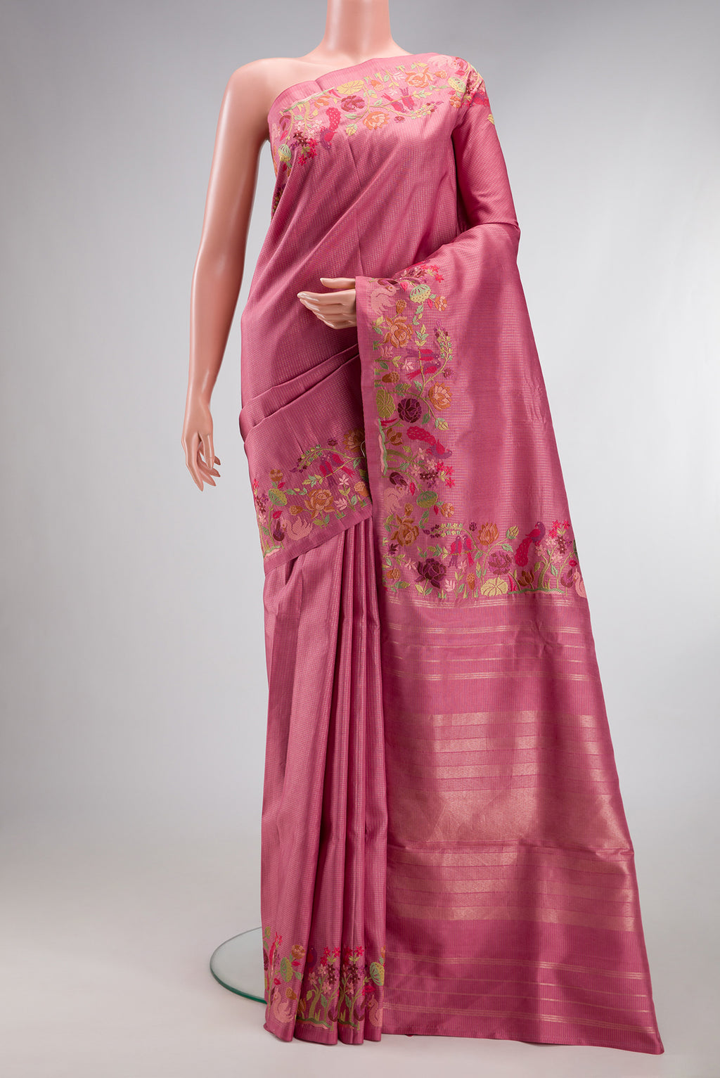 Pink Kanchipuram Silk Saree with Zari Brocade on the body and Embroidery Border.  displayed on a mannequin