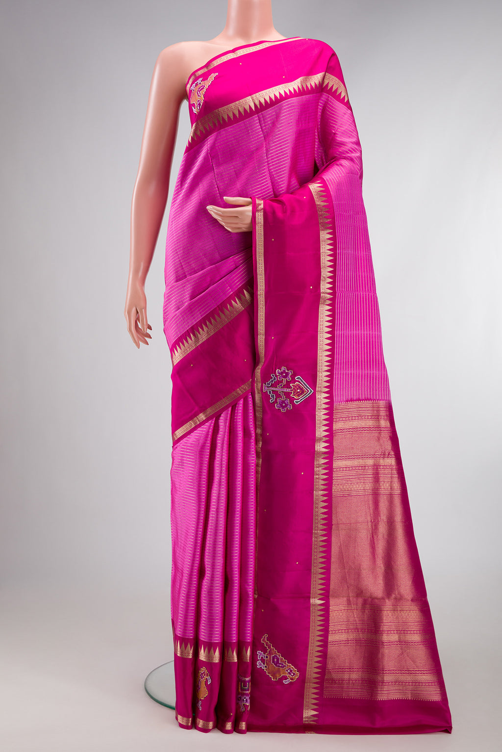 Rose pink Kanchipuram Silk Saree with Stripes on the body and Fancy Border.  displayed on a mannequin