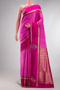 Rose pink Kanchipuram Silk Saree with Stripes on the body and Fancy Border.  displayed on a mannequin