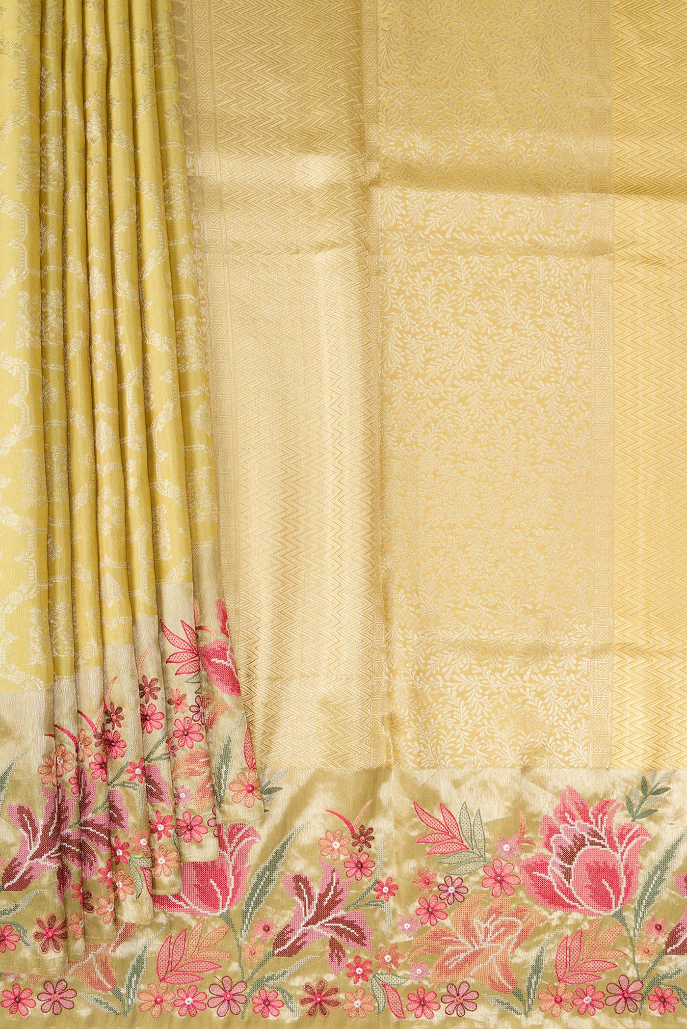 Pleats and pallu of Sandal Dual Tone Kanchipuram Silk Saree with Zari Brocade on the body and Embroidery Border. 