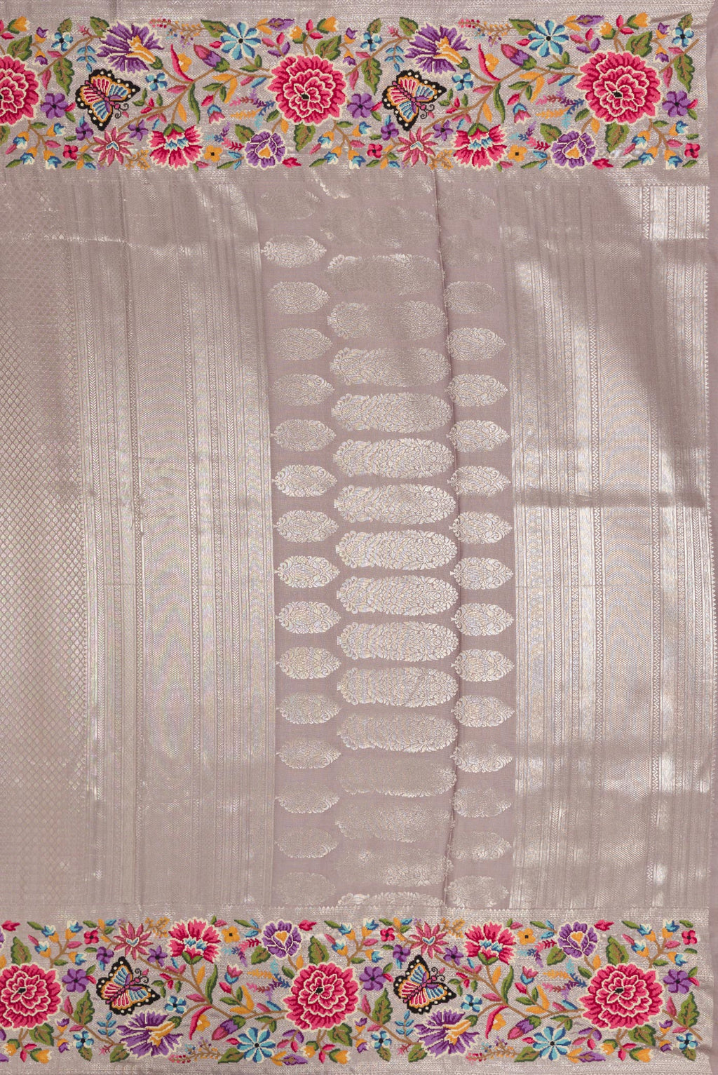 Close up image of the pallu of Grey Kanjivaram Silk Saree with Zari Brocade on the body and Embroidery Border. 