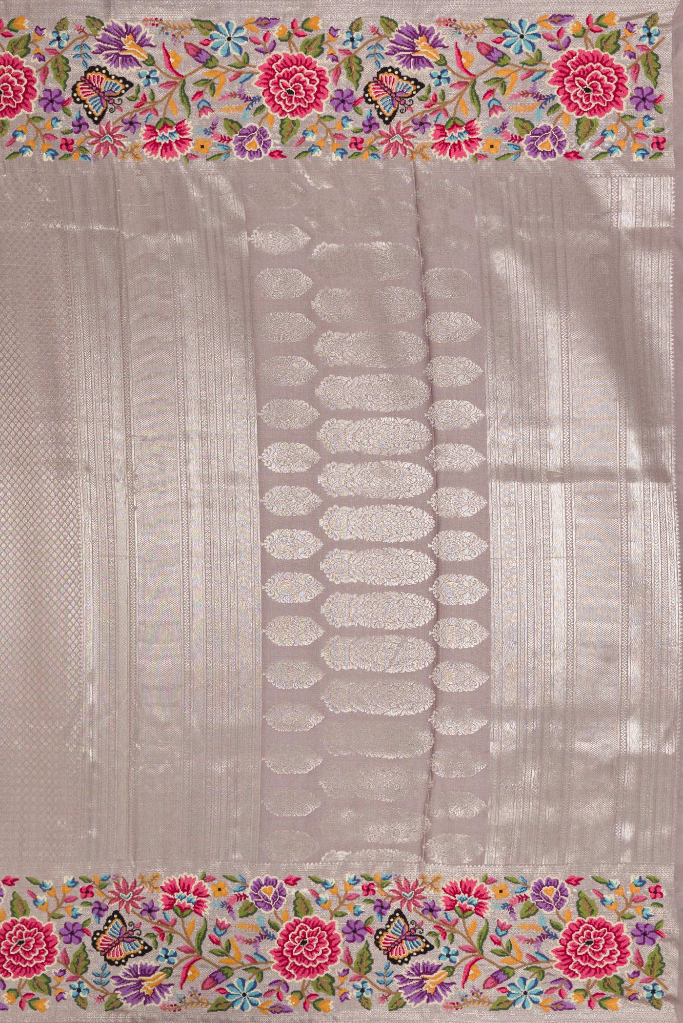 Close up image of the pallu of Grey Kanjivaram Silk Saree with Zari Brocade on the body and Embroidery Border. 
