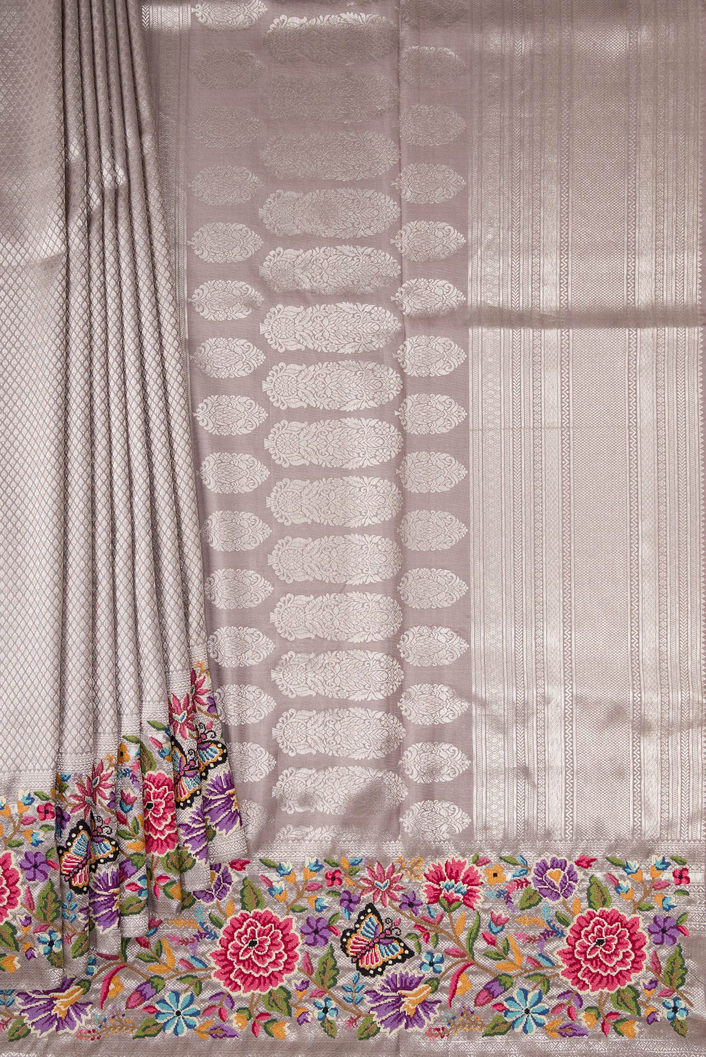 Pleats and pallu of Grey Kanjivaram Silk Saree with Zari Brocade on the body and Embroidery Border. 