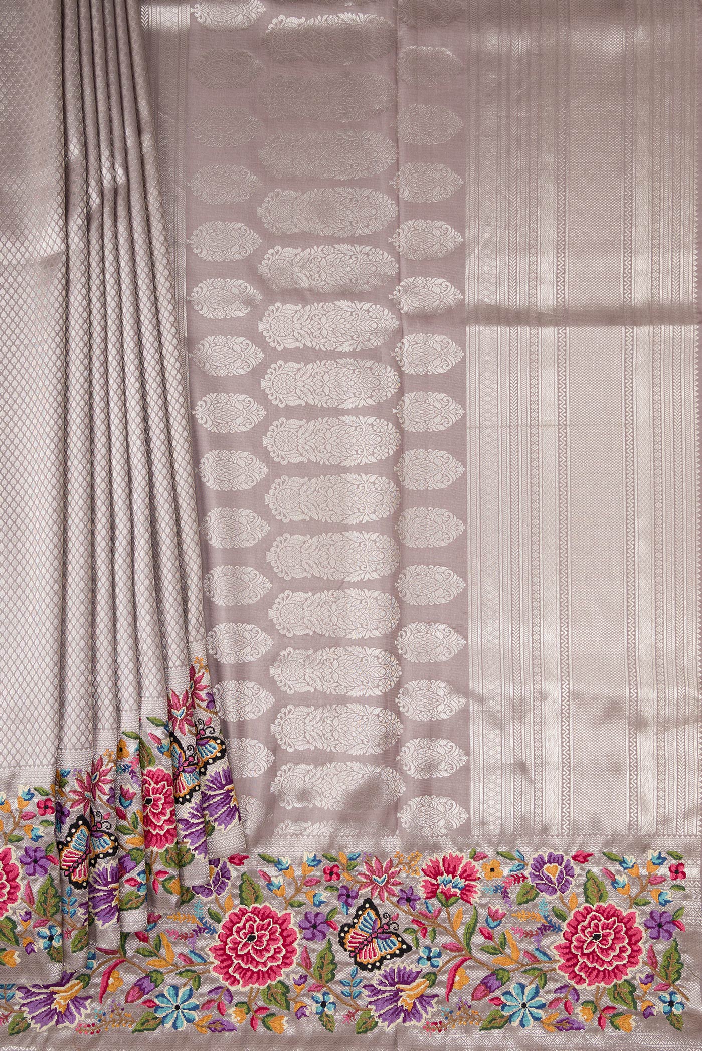 Pleats and pallu of Grey Kanjivaram Silk Saree with Zari Brocade on the body and Embroidery Border. 