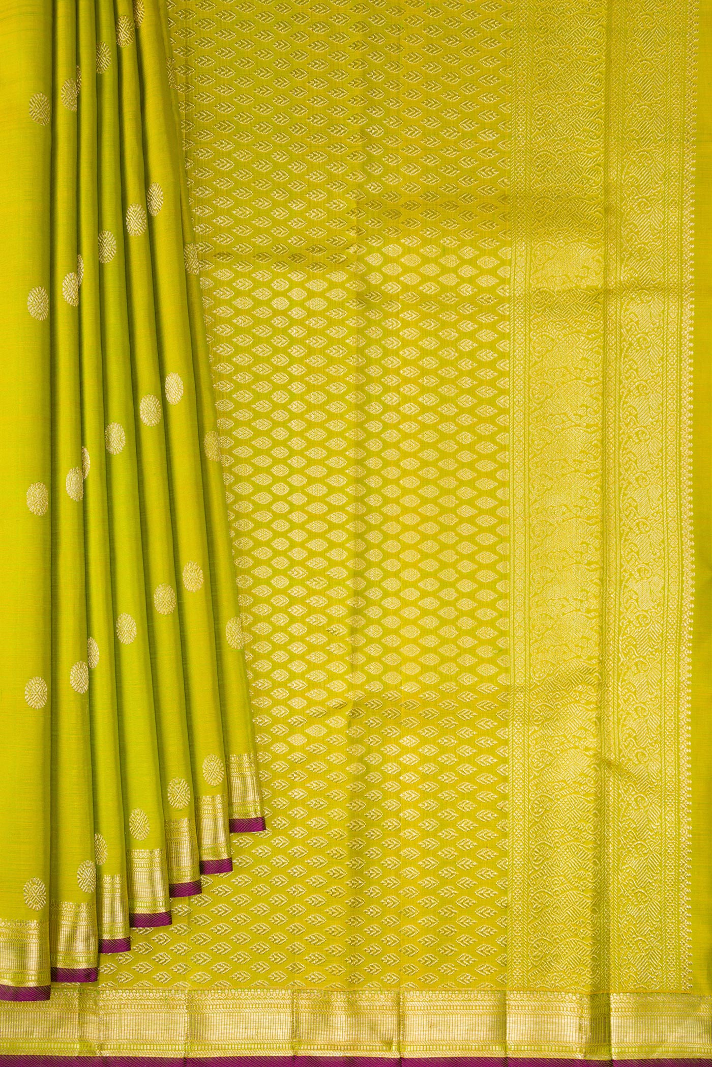 Pleats and pallu of Parrot Green Kanjivaram Silk Saree with Zari Butta on the body and Zari Border. 