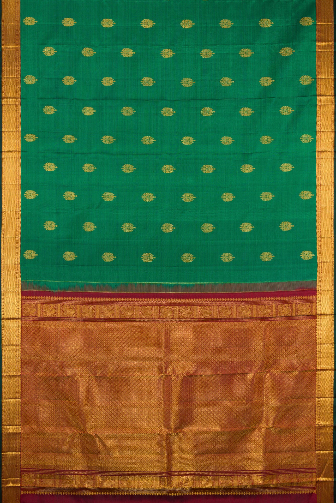 Flat view of Green Kanjivaram Silk Saree with Zari Butta on the body and Zari Border. 