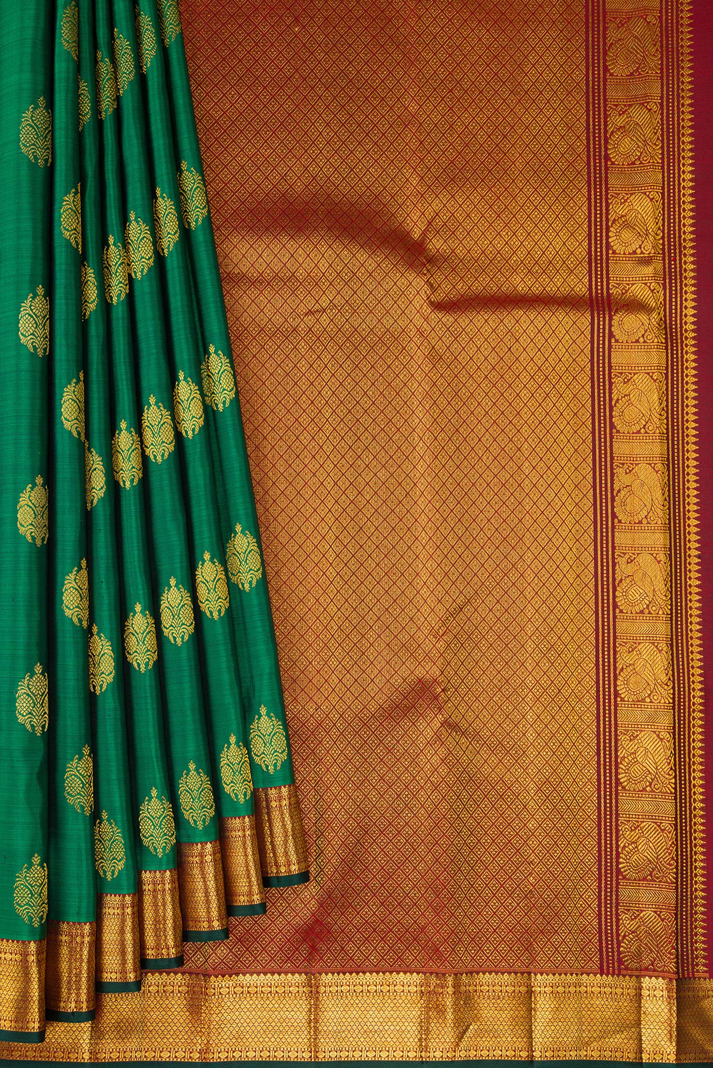 Pleats and pallu of Green Kanjivaram Silk Saree with Zari Butta on the body and Zari Border. 