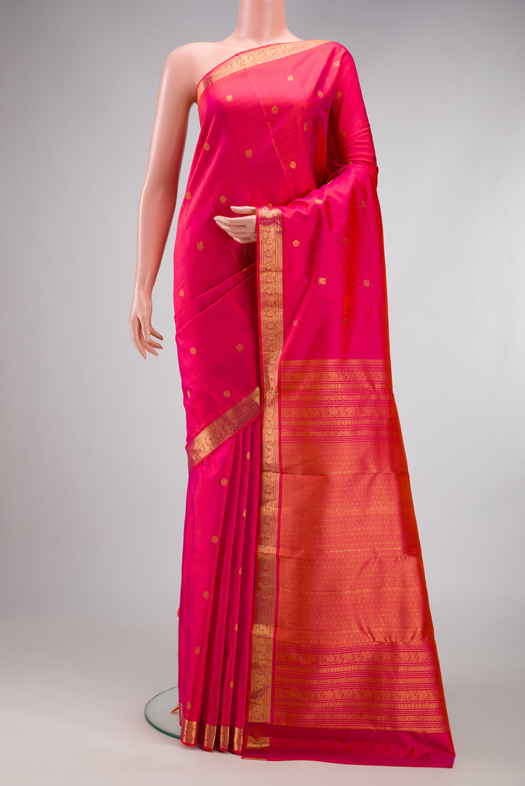 Pink Dual Tone Kanjivaram Silk Saree with Zari Butta on the body and Zari Border.  displayed on a mannequin