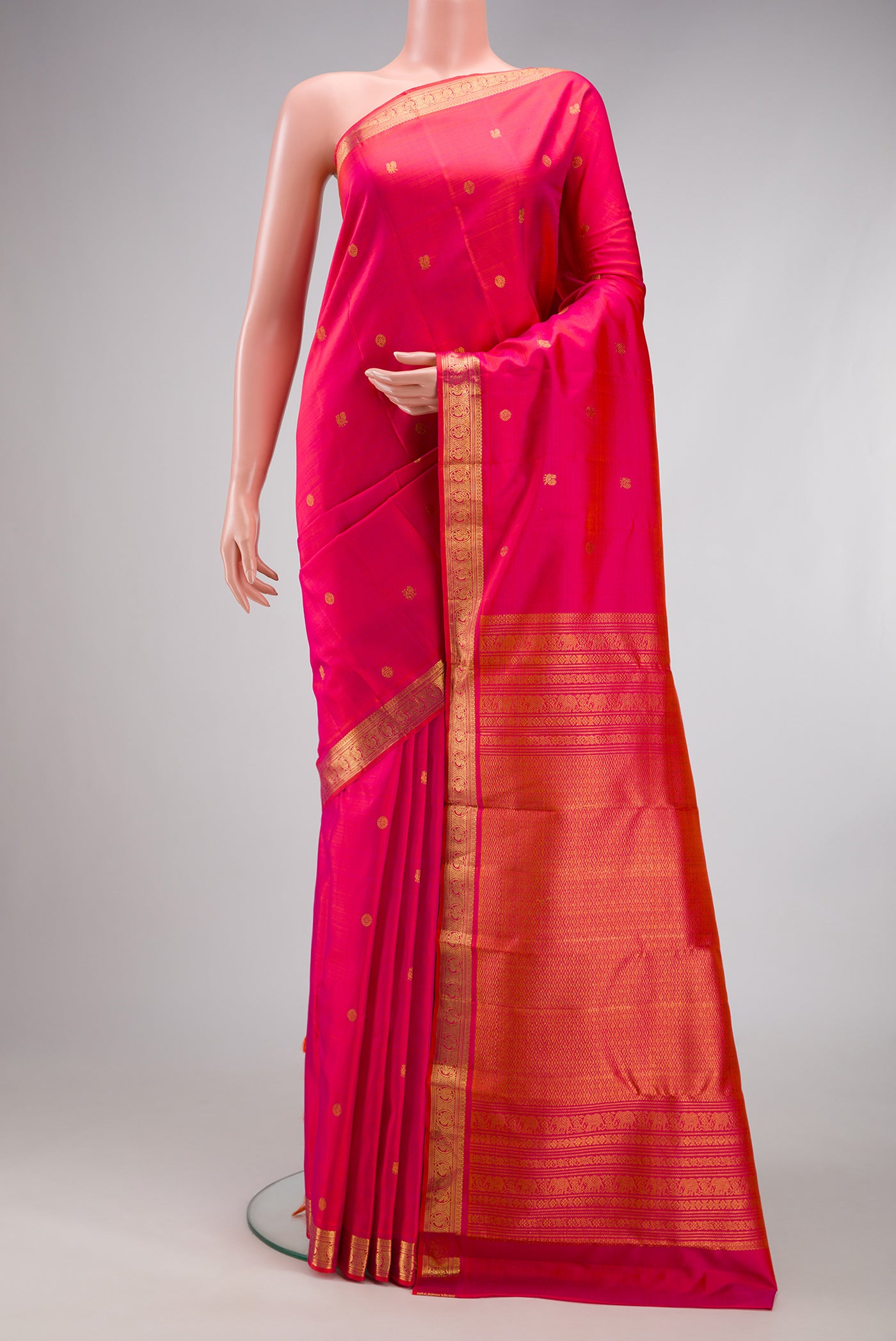 Pink Dual Tone Kanjivaram Silk Saree with Zari Butta on the body and Zari Border.  displayed on a mannequin