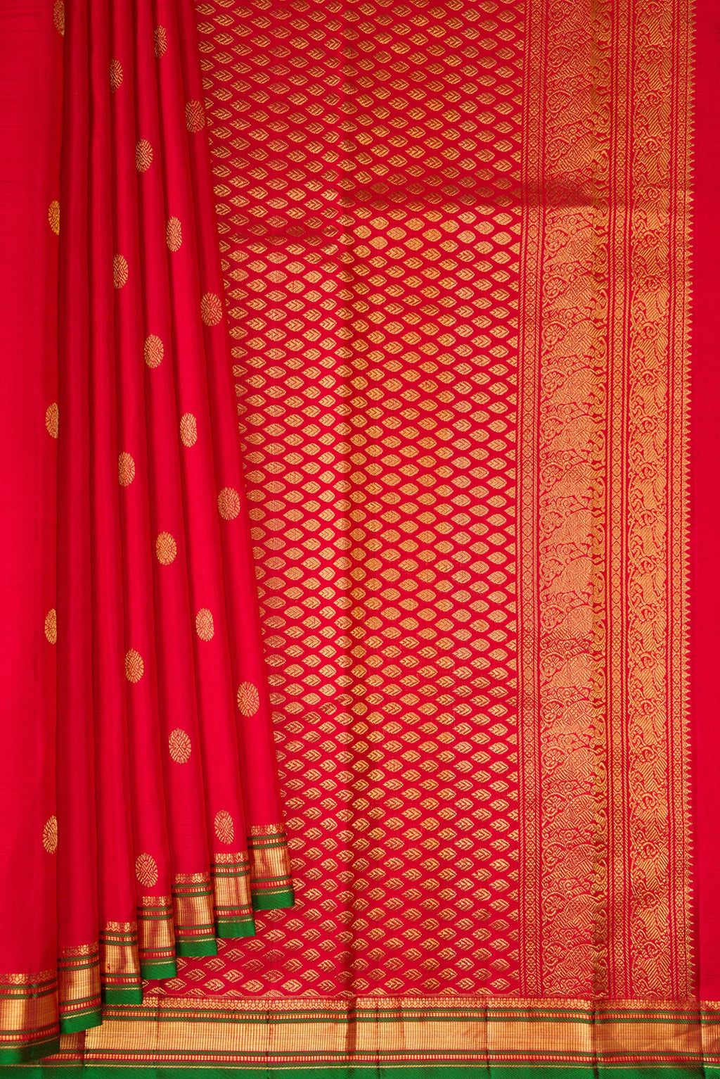 Pleats and pallu of Red Kanjivaram Silk Saree with Zari Butta on the body and Zari Border. 
