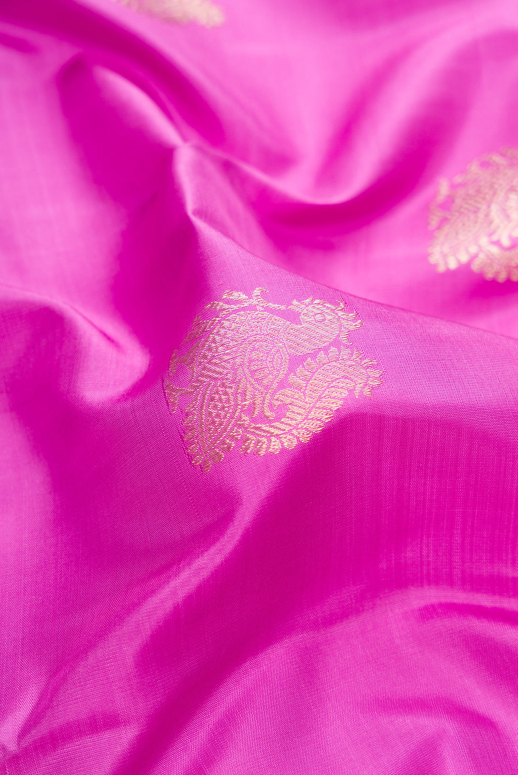 Close up of Lavender Kanjivaram Silk Saree with Zari Butta on the body and Zari Border.  displaying folds