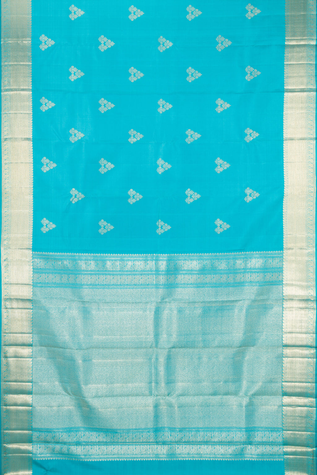 Flat view of Light Blue Kanjivaram Silk Saree with Zari Butta on the body and Zari Border. 